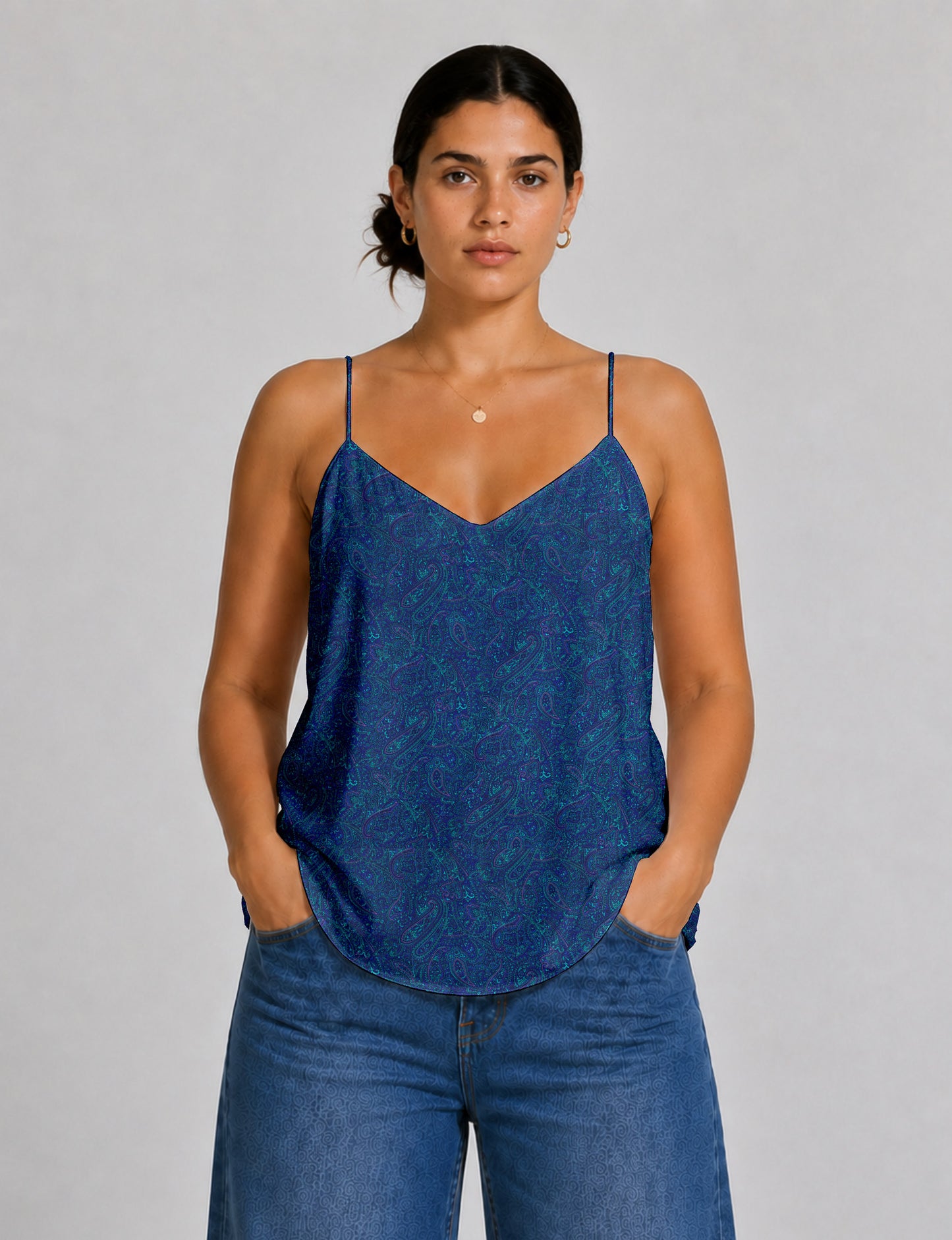 Women's sleeveless slip top with a relaxed straight fit, soft V-neckline, deep V-back, and delicate spaghetti straps.