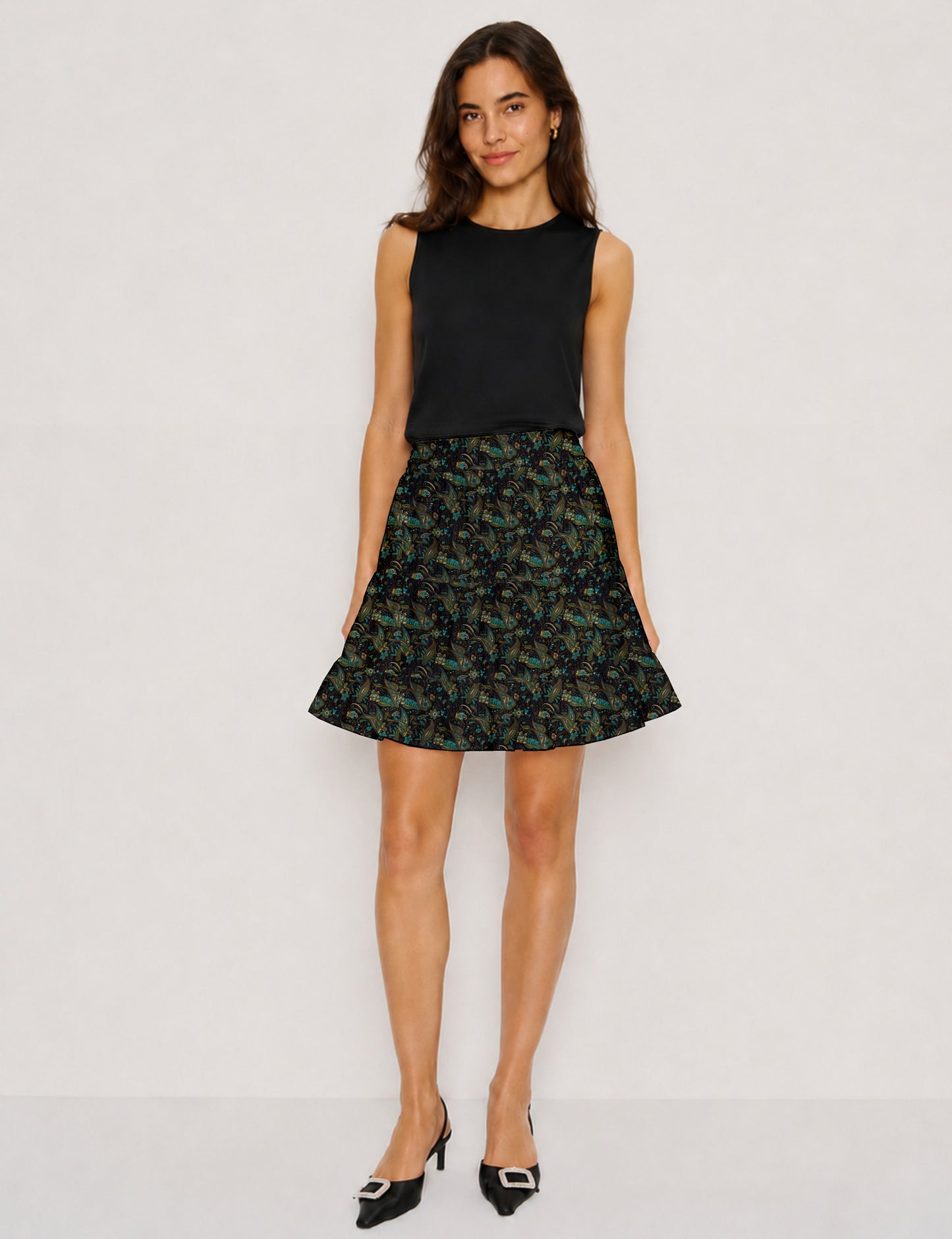 Short tiered skirt with a fitted waistband, knife pleats, softly flared silhouette, side seam pockets, and above-the-knee length.