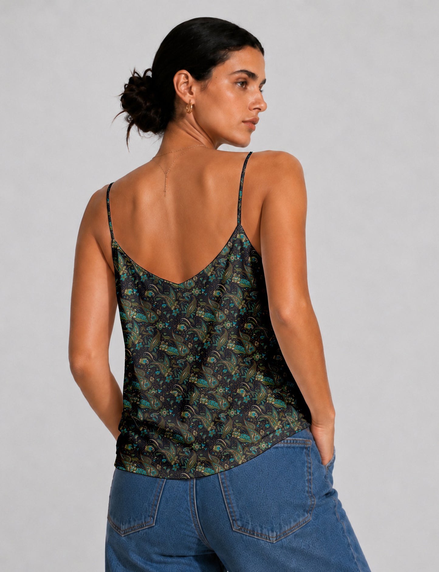 Women's sleeveless slip top with a relaxed straight fit, soft V-neckline, deep V-back, and delicate spaghetti straps.