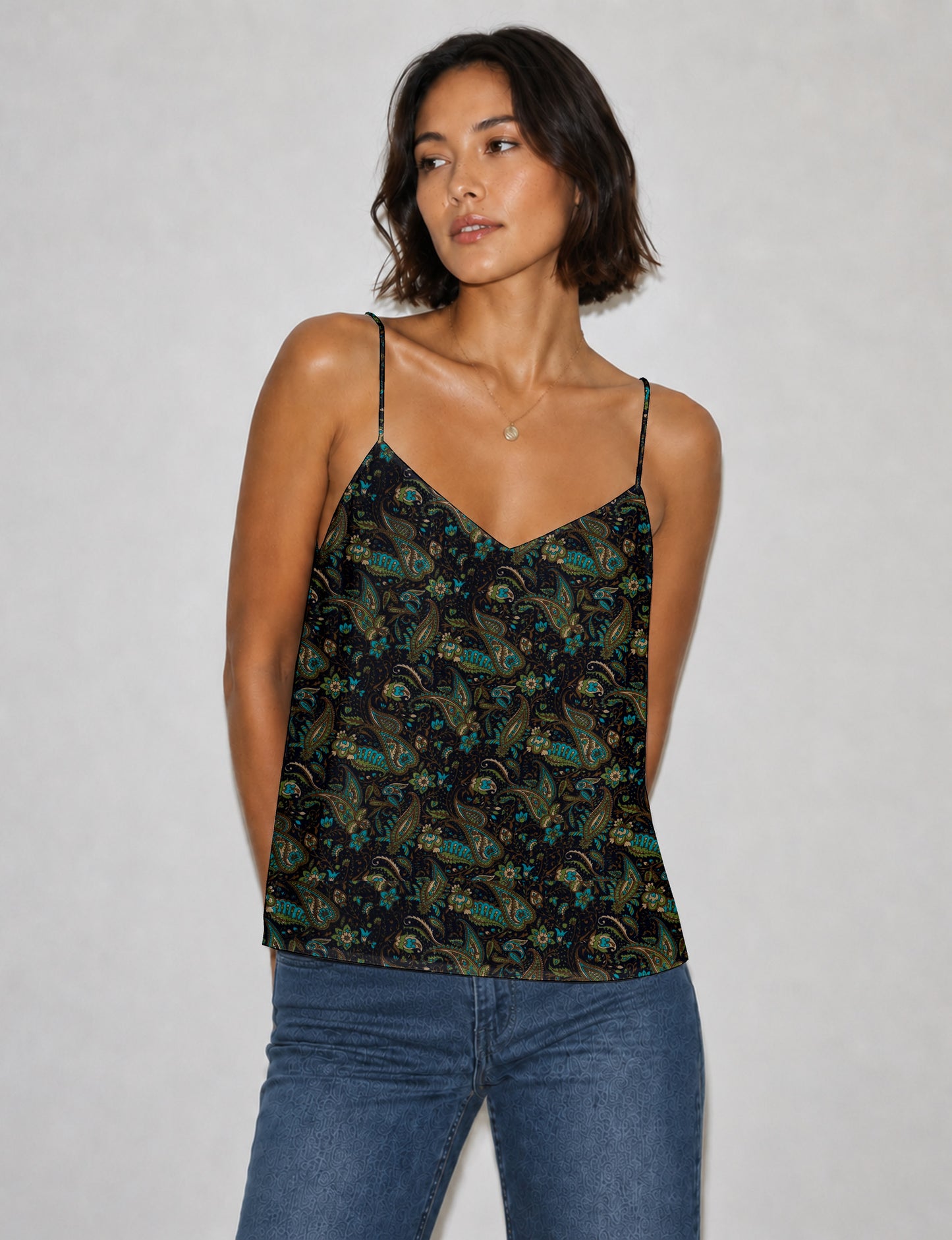 Women's sleeveless slip top with a relaxed straight fit, soft V-neckline, deep V-back, and delicate spaghetti straps.