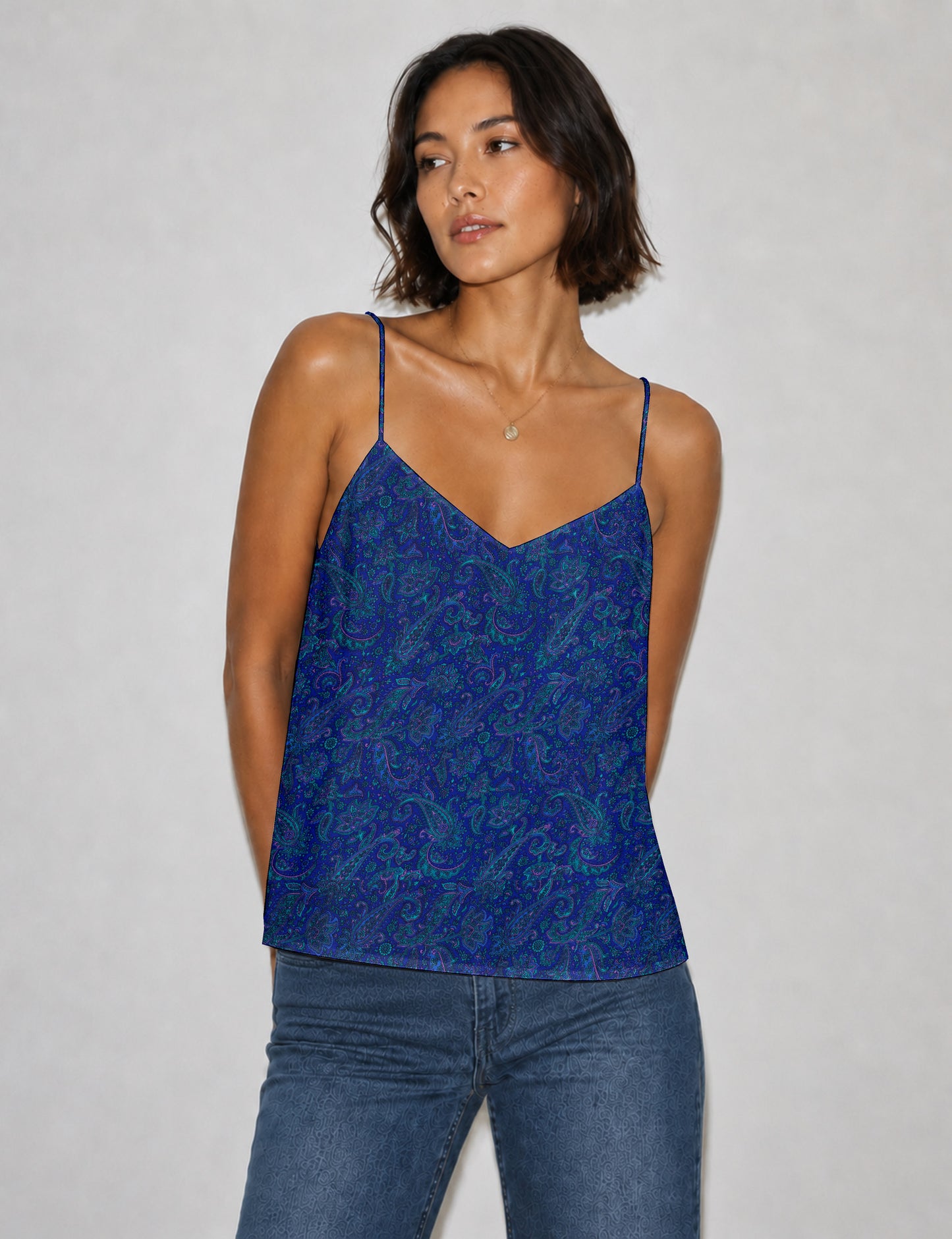 Women's sleeveless slip top with a relaxed straight fit, soft V-neckline, deep V-back, and delicate spaghetti straps.