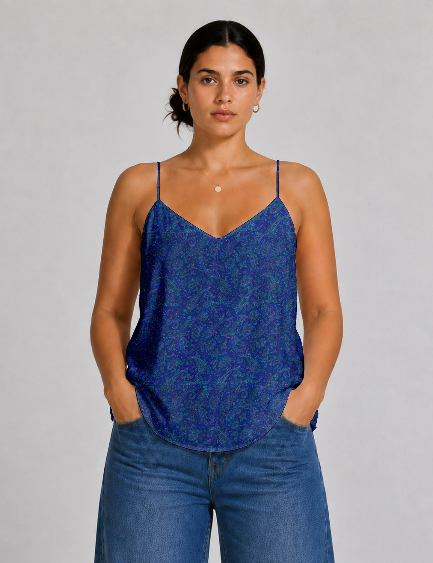 Women's sleeveless slip top with a relaxed straight fit, soft V-neckline, deep V-back, and delicate spaghetti straps.