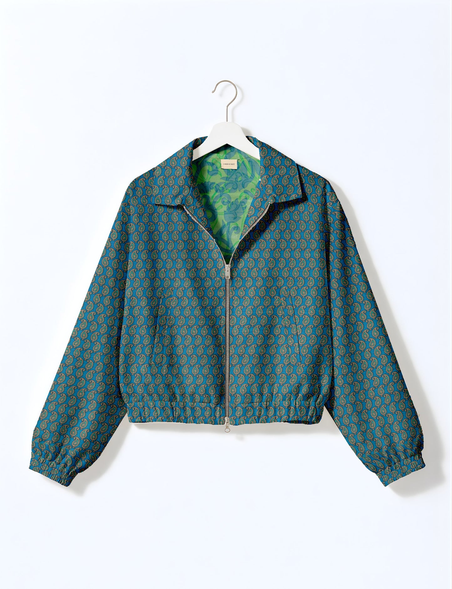 Upcycled Bomber Jacket made from recycled sari materials, featuring a cute cropped shape, elasticated hem and cuffs, and contrast sari print lining. Sustainable apparel promoting eco-friendly fashion and ethical clothing.