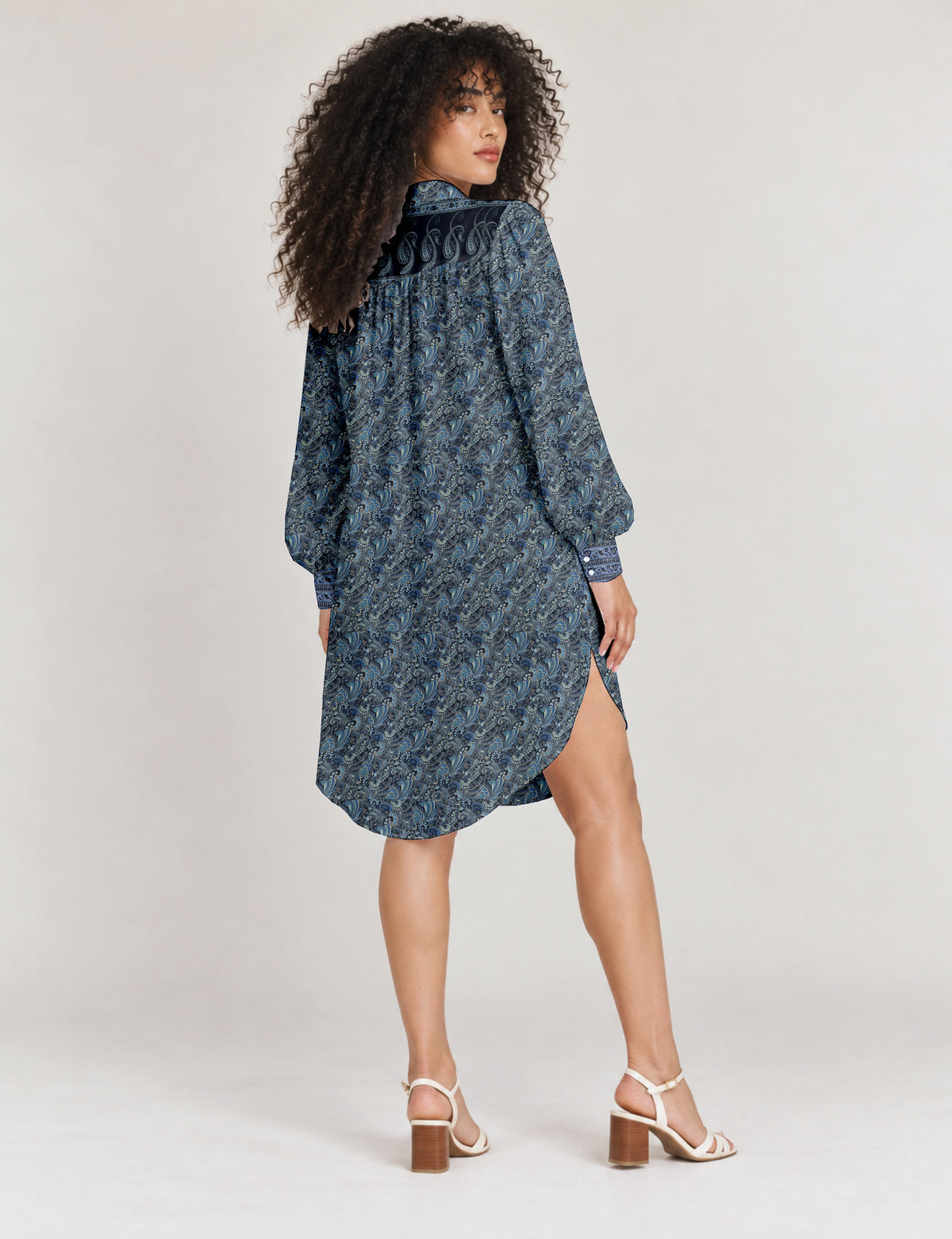 High low shirt with a relaxed fit, button-down front, classic collar, gathered shoulders and full-length blouson sleeves.