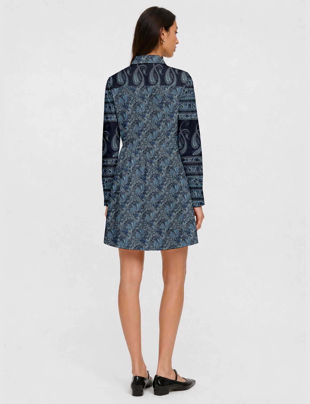 Short shirt dress with a relaxed A-line silhouette, point collar, partial button placket, gathered waist, side pockets, and full-length cuffed sleeves.
