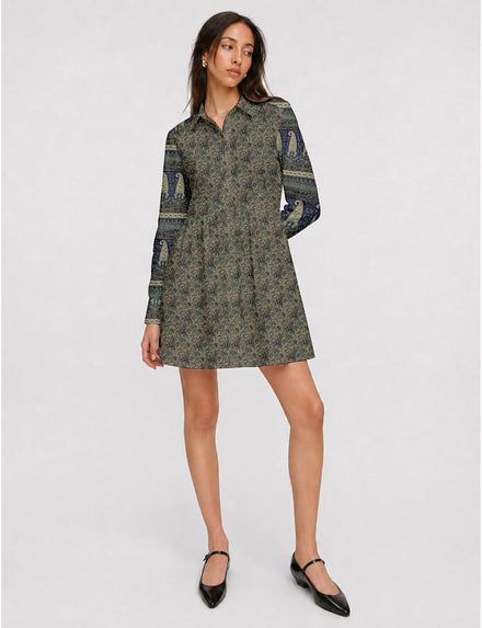 Short shirt dress with a relaxed A-line silhouette, point collar, partial button placket, gathered waist, side pockets, and full-length cuffed sleeves.
