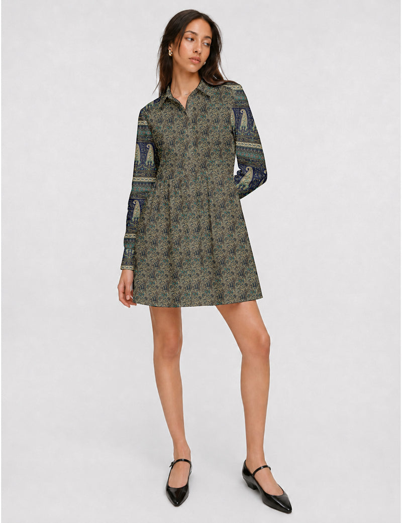 Short shirt dress with a relaxed A-line silhouette, point collar, partial button placket, gathered waist, side pockets, and full-length cuffed sleeves.