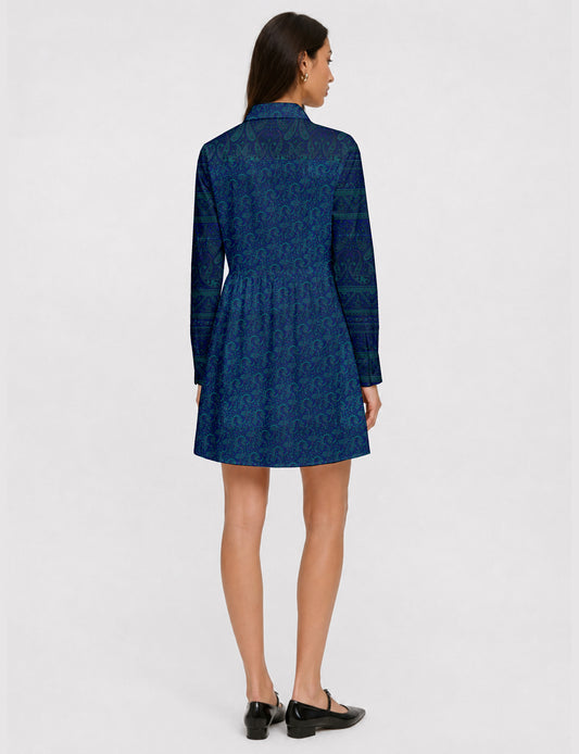 Short shirt dress with a relaxed A-line silhouette, point collar, partial button placket, gathered waist, side pockets, and full-length cuffed sleeves.