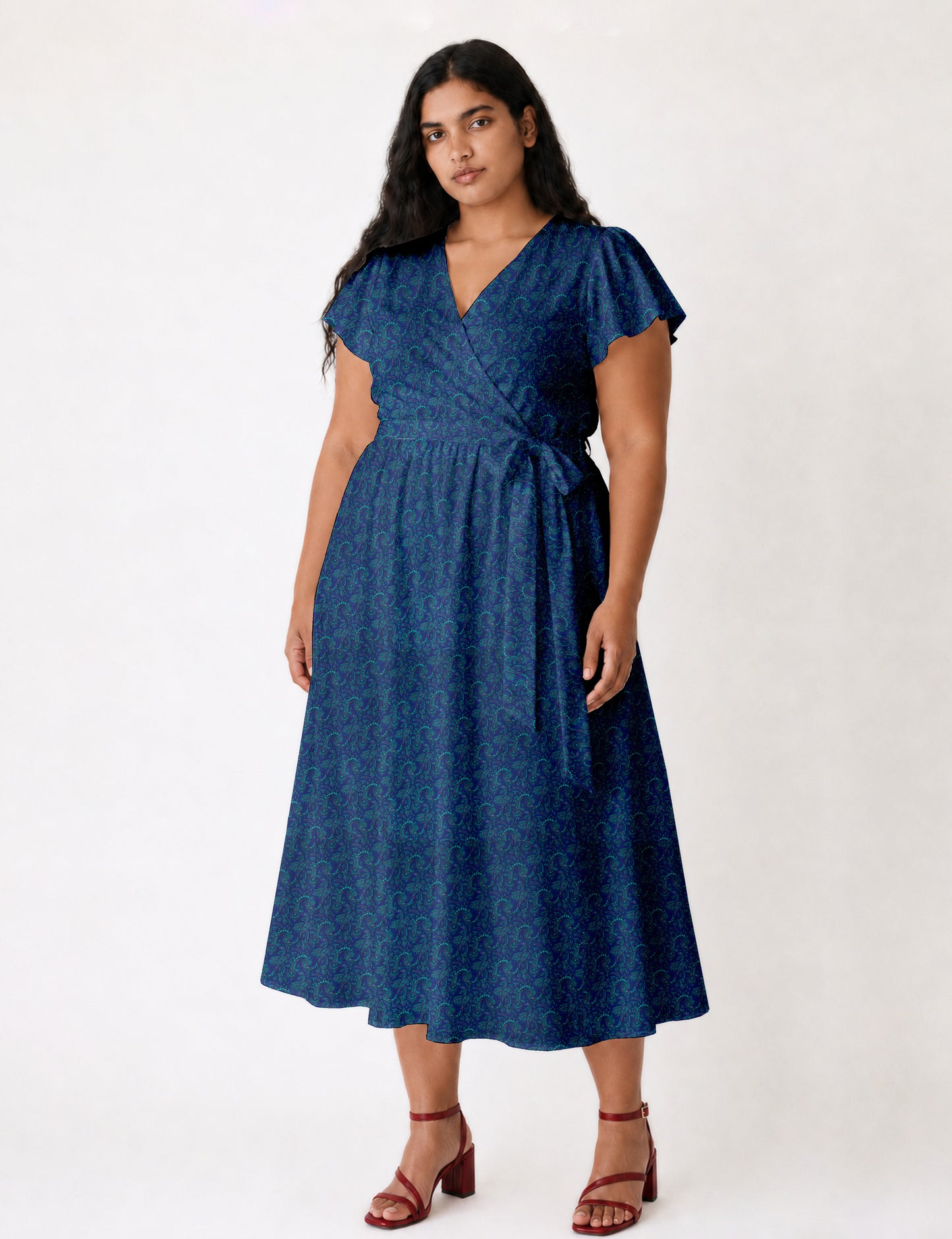 Elegant midi wrap dress with a V-neckline, adjustable waist tie, fitted bodice, and flared skirt for a timeless, flattering silhouette.