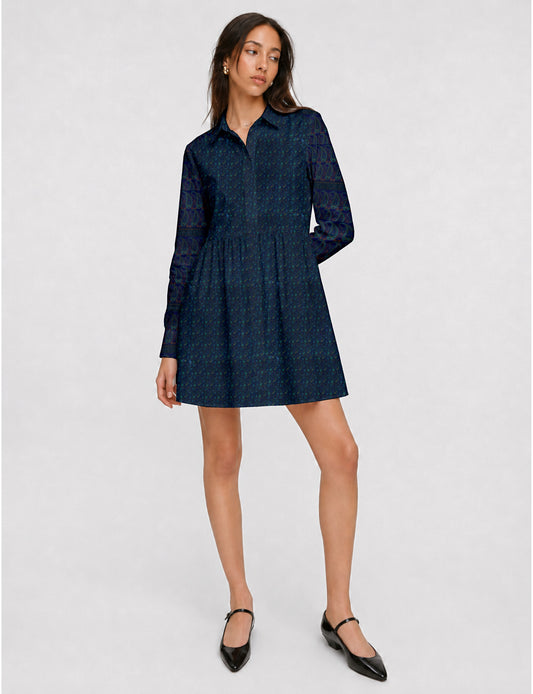 Short shirt dress with a relaxed A-line silhouette, point collar, partial button placket, gathered waist, side pockets, and full-length cuffed sleeves.