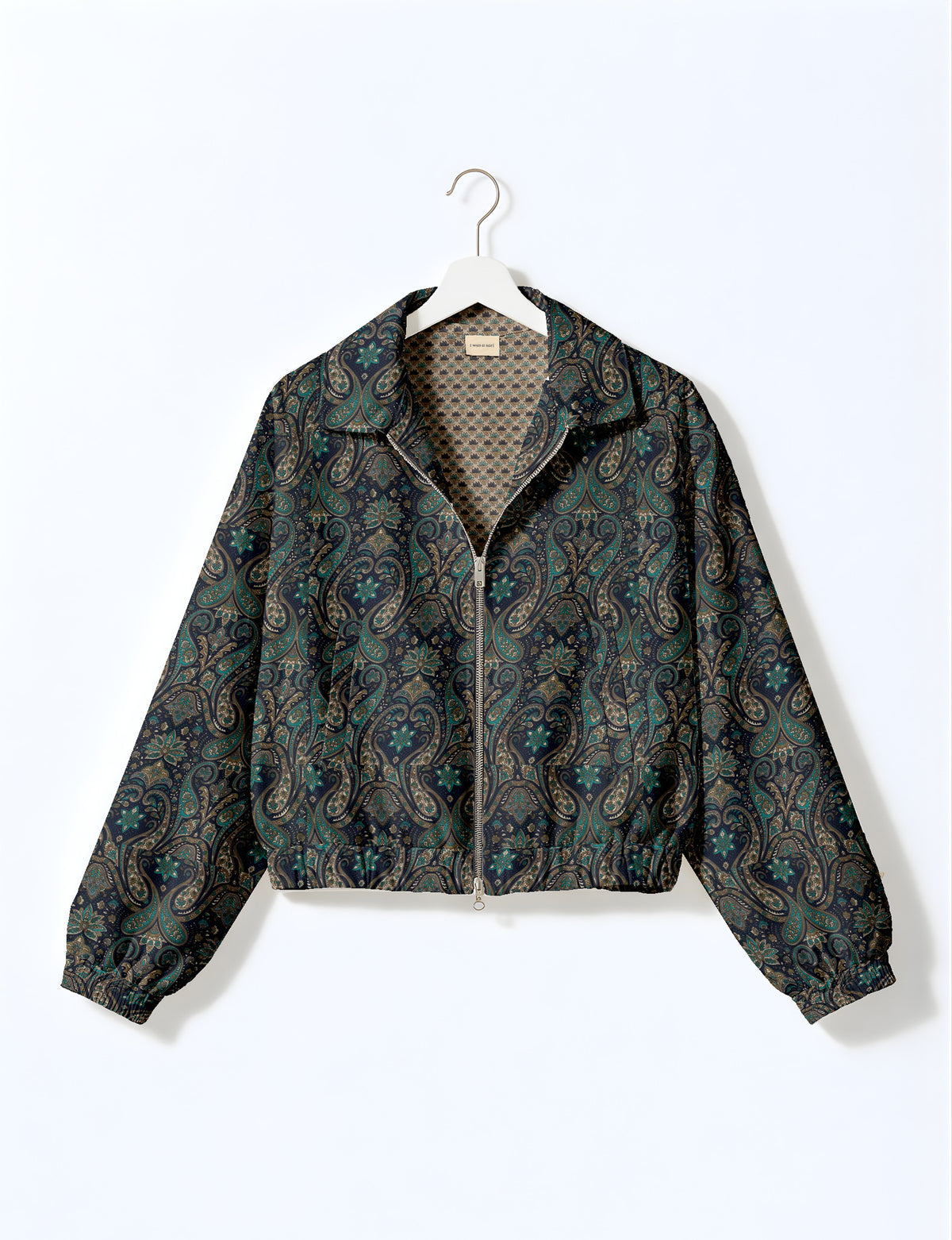 Brown floral bomber jacket with front zipper, elastic cuffs and hem, hanging on white hanger, red floral inner lining visible