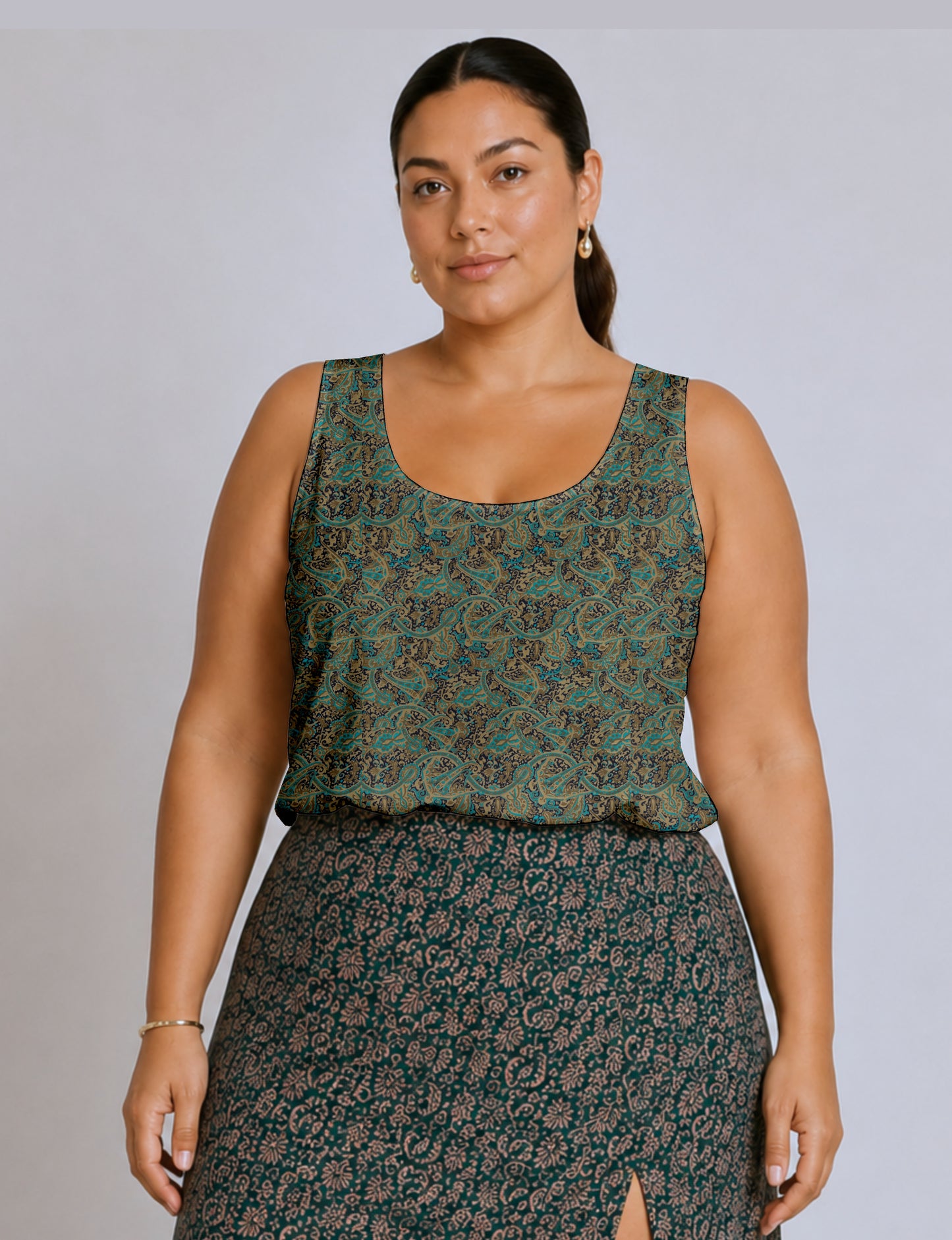 Women's sleeveless blouse with a relaxed straight fit, wide scoop neckline, deep scoop back, and hip-length silhouette.