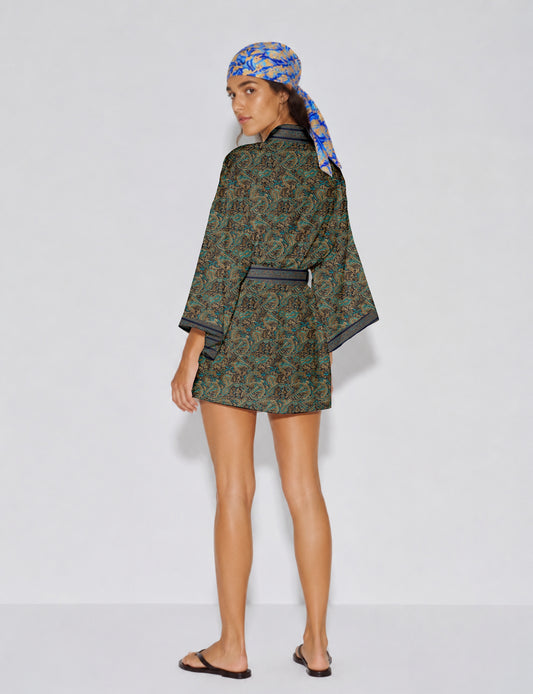 Short kimono robe with wrap front, V-neckline, wide sleeves, waist tie, and concealed skort detail.