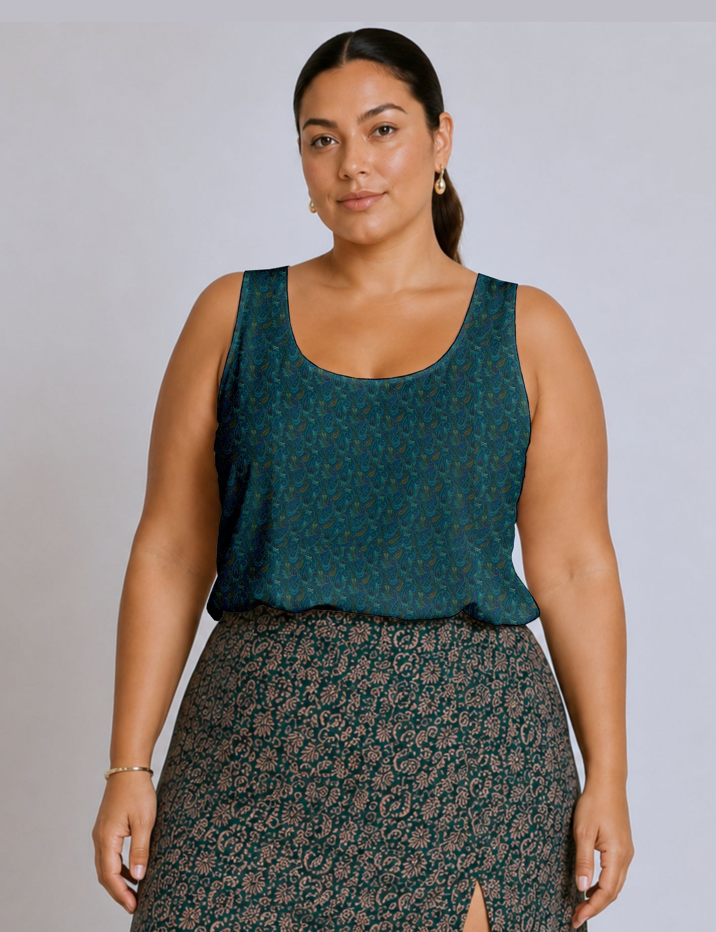Women's sleeveless blouse with a relaxed straight fit, wide scoop neckline, deep scoop back, and hip-length silhouette.