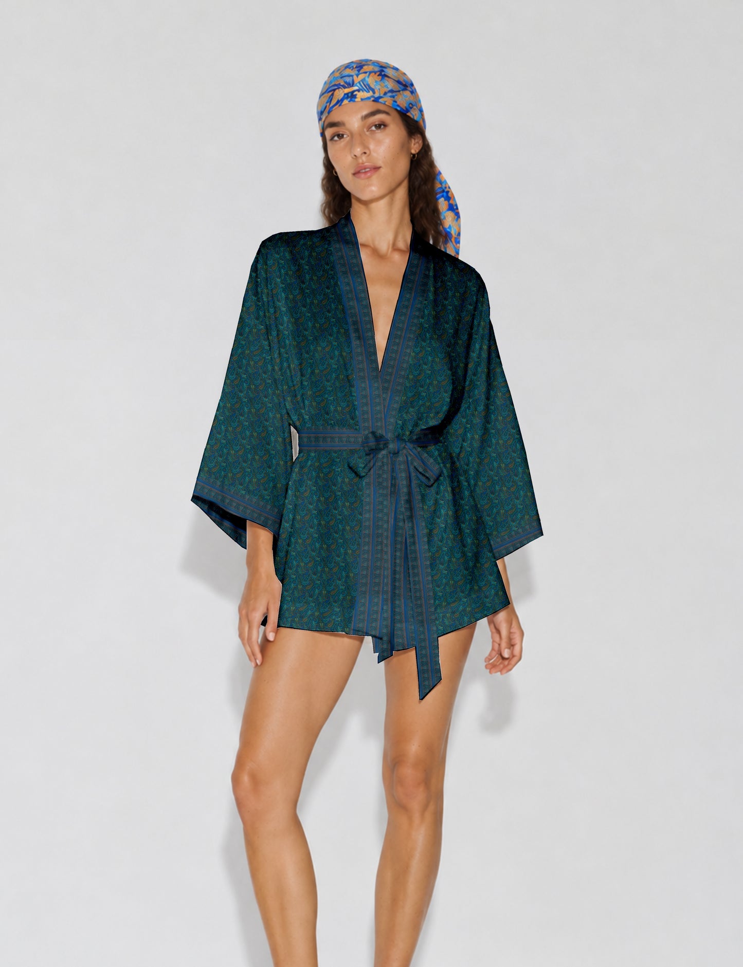 Short kimono robe with wrap front, V-neckline, wide sleeves, waist tie, and concealed skort detail.
