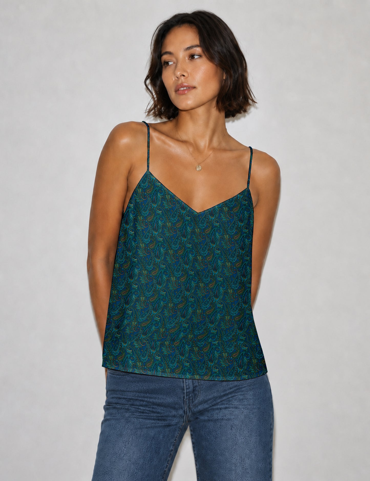 Women's sleeveless slip top with a relaxed straight fit, soft V-neckline, deep V-back, and delicate spaghetti straps.