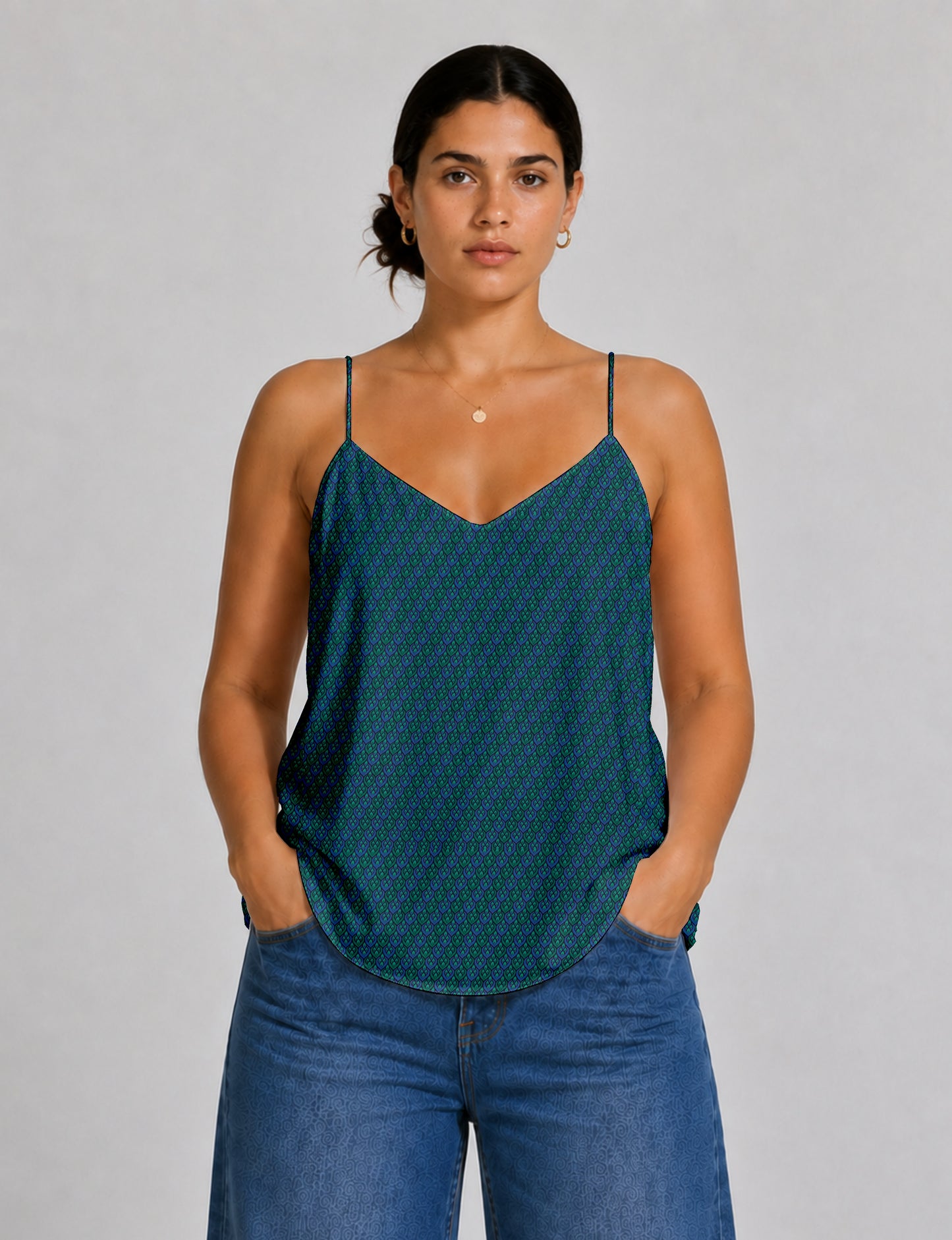 Women's sleeveless slip top with a relaxed straight fit, soft V-neckline, deep V-back, and delicate spaghetti straps.