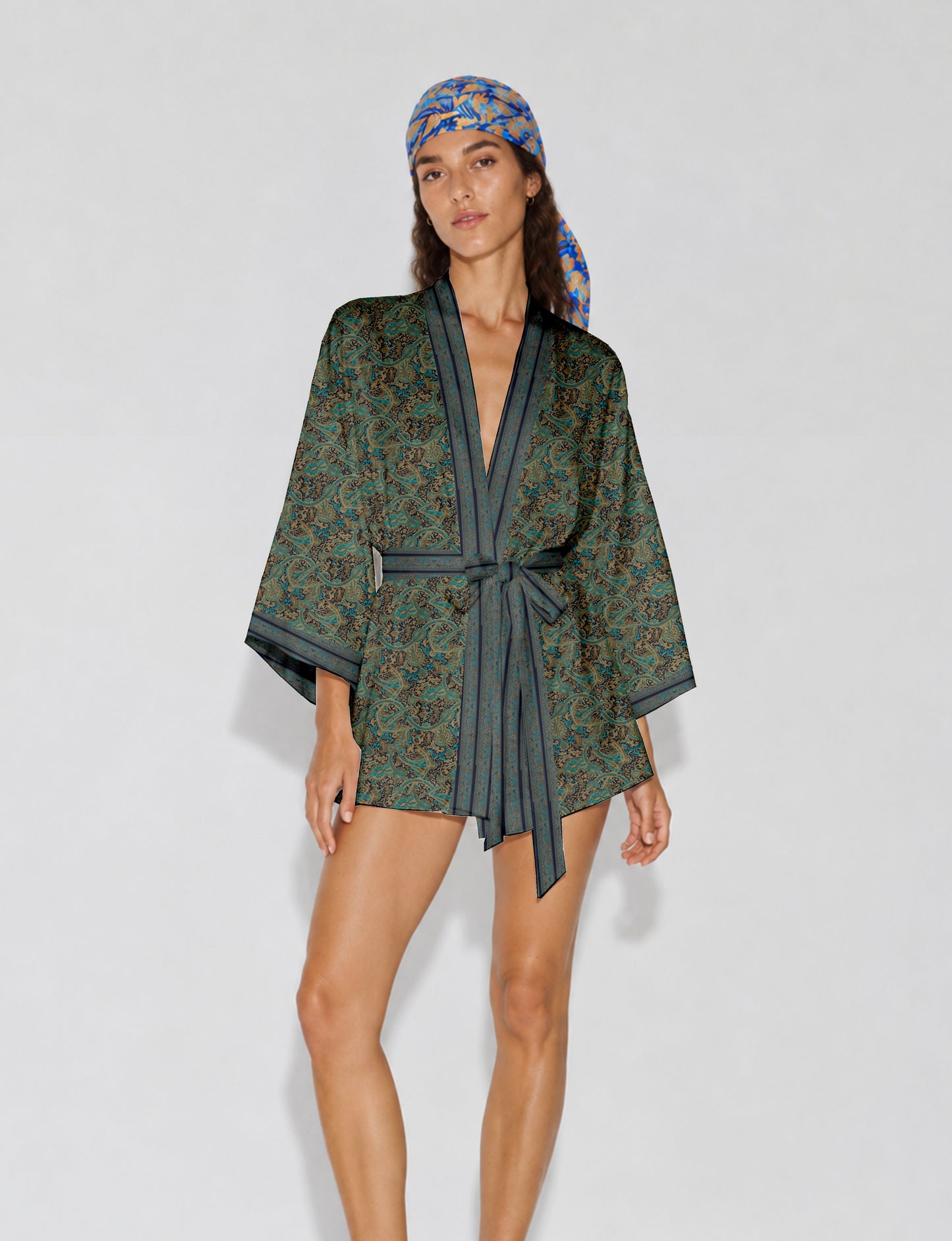 Short kimono robe with wrap front, V-neckline, wide sleeves, waist tie, and concealed skort detail.
