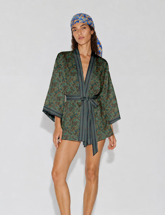 Short kimono robe with wrap front, V-neckline, wide sleeves, waist tie, and concealed skort detail.