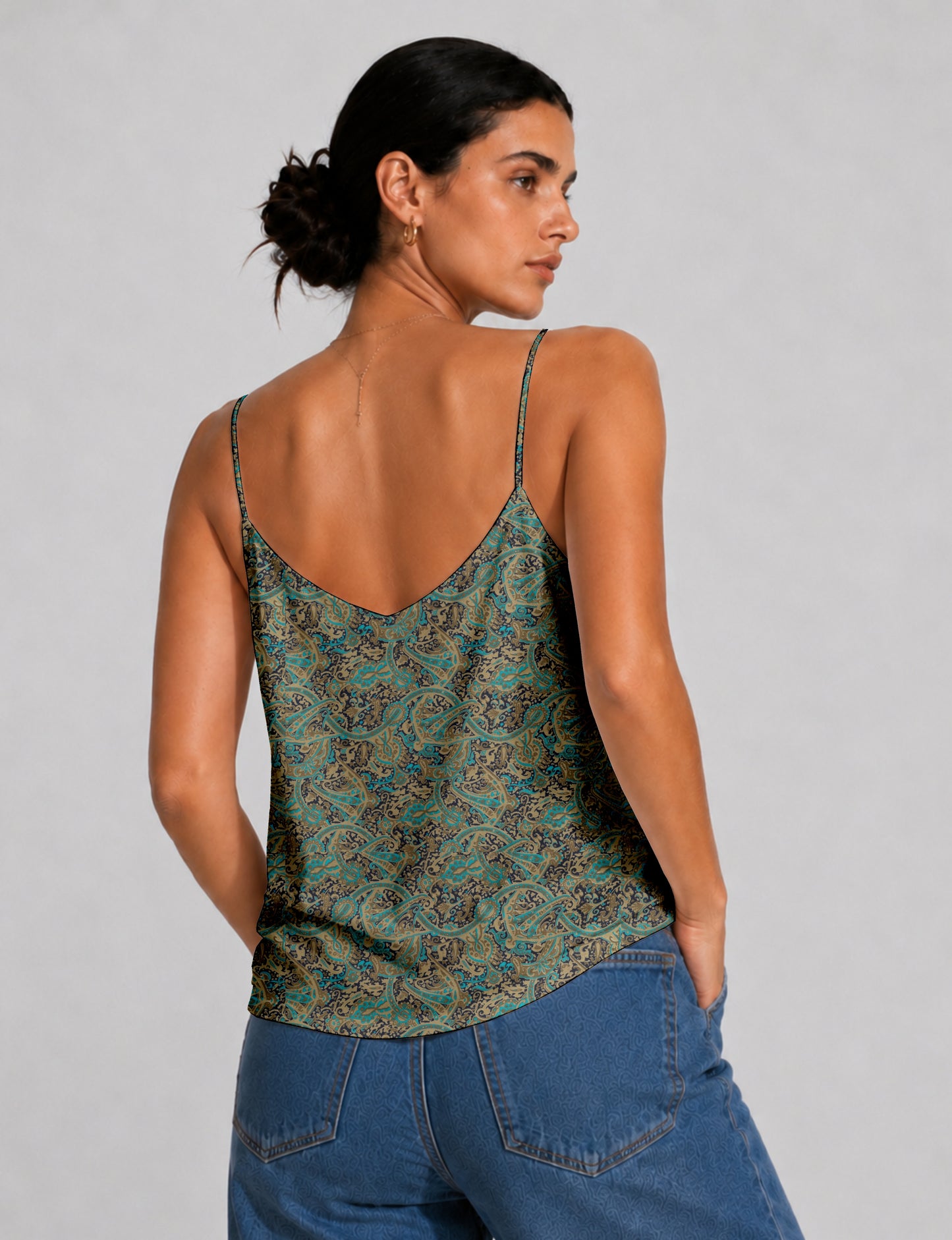 Women's sleeveless slip top with a relaxed straight fit, soft V-neckline, deep V-back, and delicate spaghetti straps.