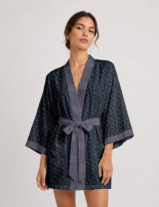 Short kimono robe with wrap front, V-neckline, wide sleeves, waist tie, and concealed skort detail.