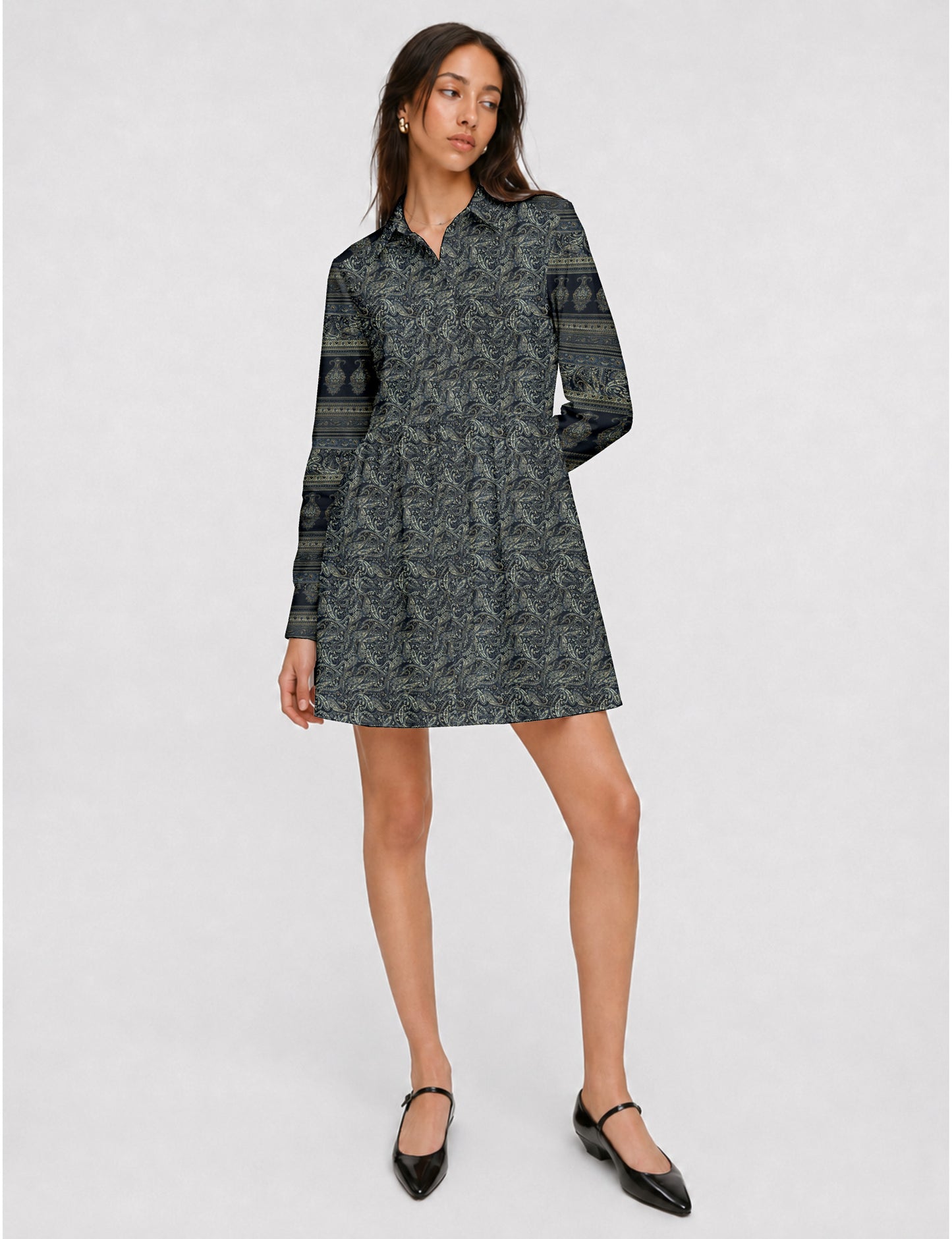 Short shirt dress with a relaxed A-line silhouette, point collar, partial button placket, gathered waist, side pockets, and full-length cuffed sleeves.