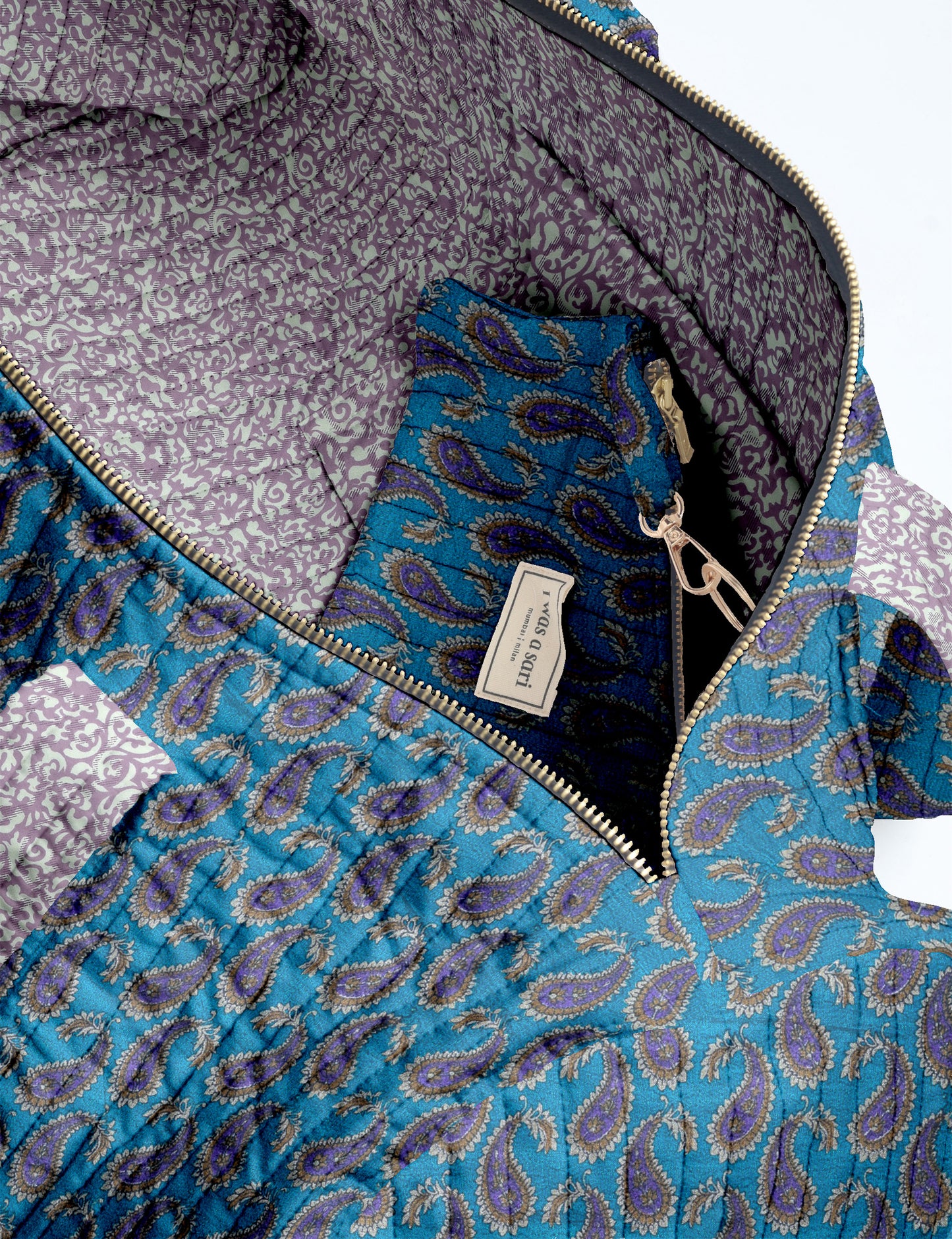 Brown paisley quilted bowling bag with dual handles, front zipper pocket, and "I was a sari" label on front side