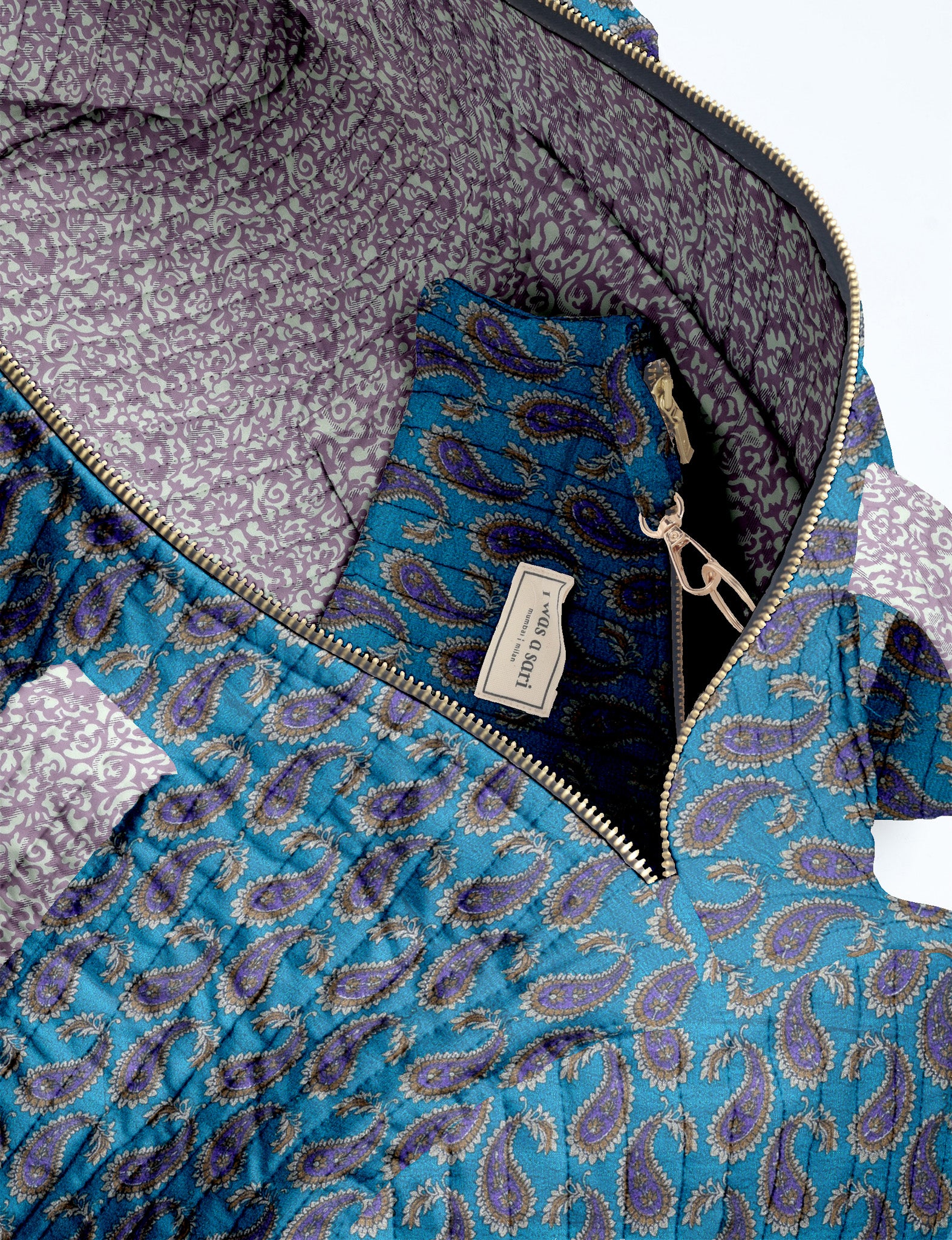Brown paisley quilted bowling bag with dual handles, front zipper pocket, and "I was a sari" label on front side