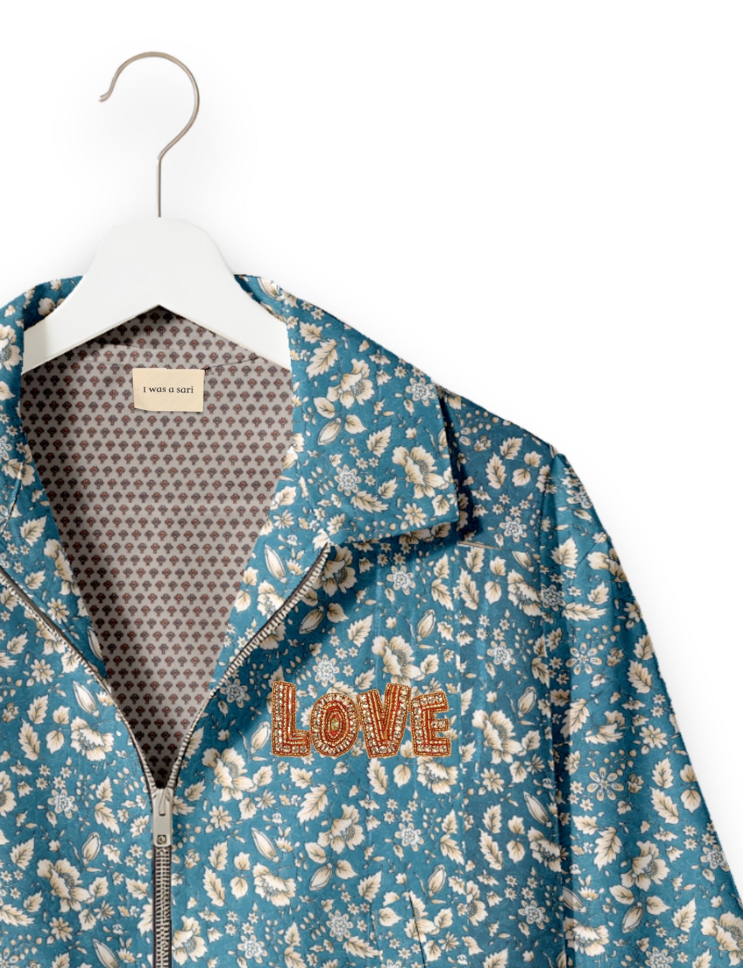 Love Bomber Jacket made from recycled fabric, featuring hand-stitched Aari embroidery. A unique piece of zero-waste clothing, part of the circular fashion movement. Designed with upcycled materials for a stylish yet environmentally friendly clothing choice.