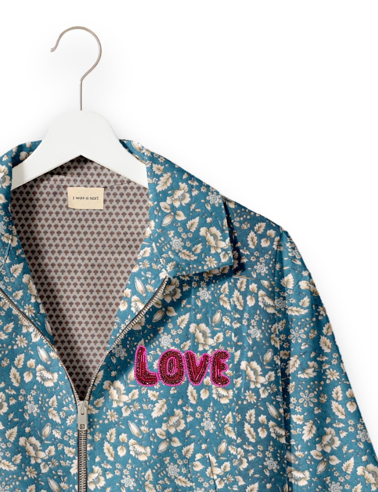 Love Bomber Jacket made from recycled fabric, featuring hand-stitched Aari embroidery. A unique piece of zero-waste clothing, part of the circular fashion movement. Designed with upcycled materials for a stylish yet environmentally friendly clothing choice.