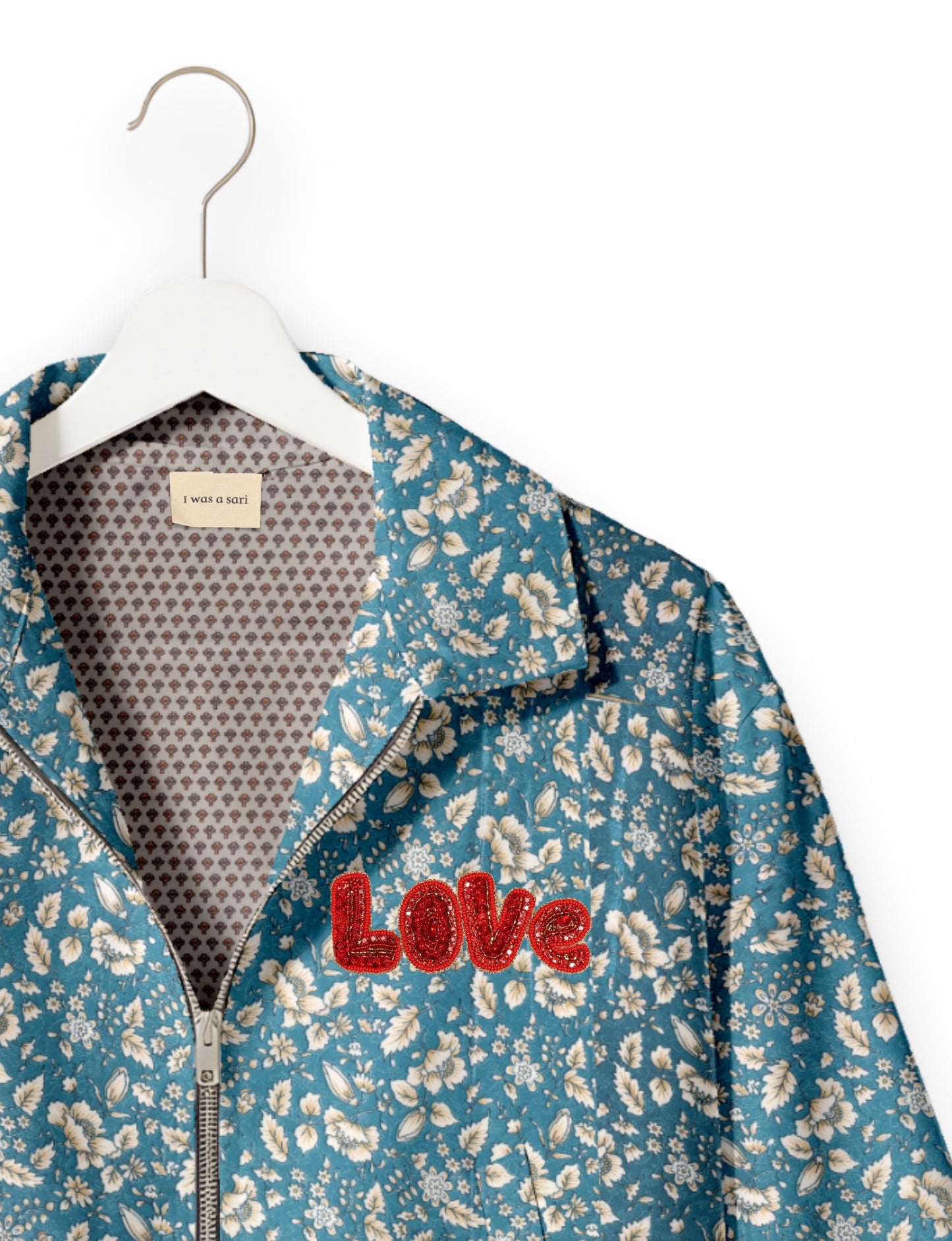 Love Bomber Jacket made from recycled fabric, featuring hand-stitched Aari embroidery. A unique piece of zero-waste clothing, part of the circular fashion movement. Designed with upcycled materials for a stylish yet environmentally friendly clothing choice.