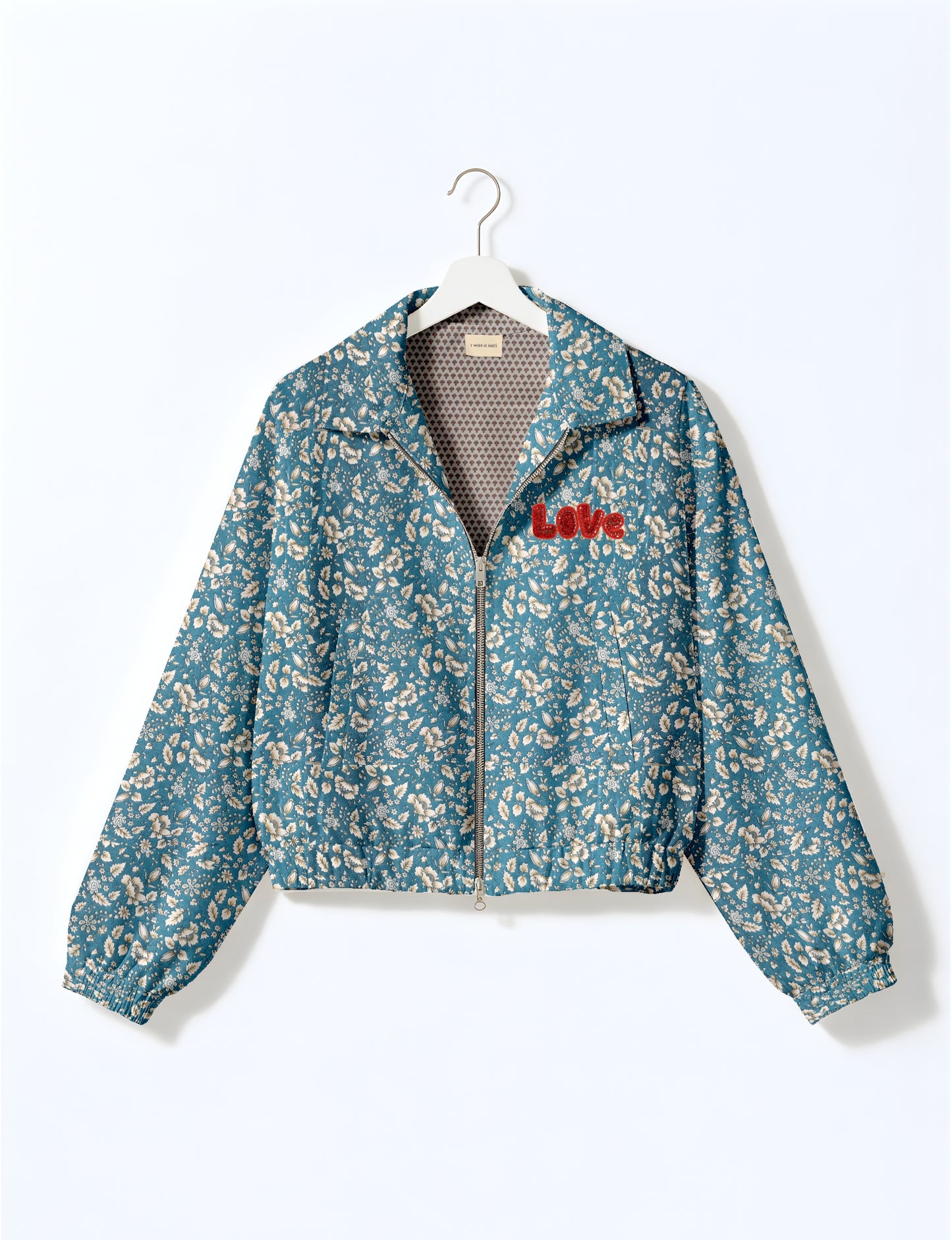 Love Bomber Jacket made from recycled fabric, featuring hand-stitched Aari embroidery. A unique piece of zero-waste clothing, part of the circular fashion movement. Designed with upcycled materials for a stylish yet environmentally friendly clothing choice.