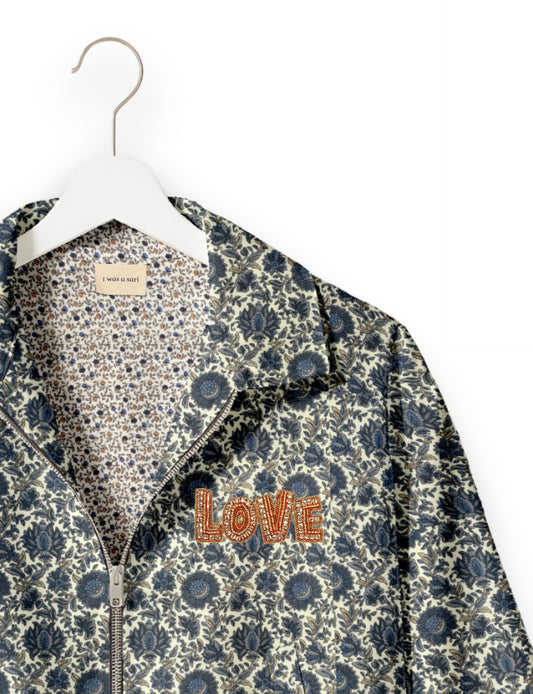 Love Bomber Jacket made from recycled fabric, featuring hand-stitched Aari embroidery. A unique piece of zero-waste clothing, part of the circular fashion movement. Designed with upcycled materials for a stylish yet environmentally friendly clothing choice.