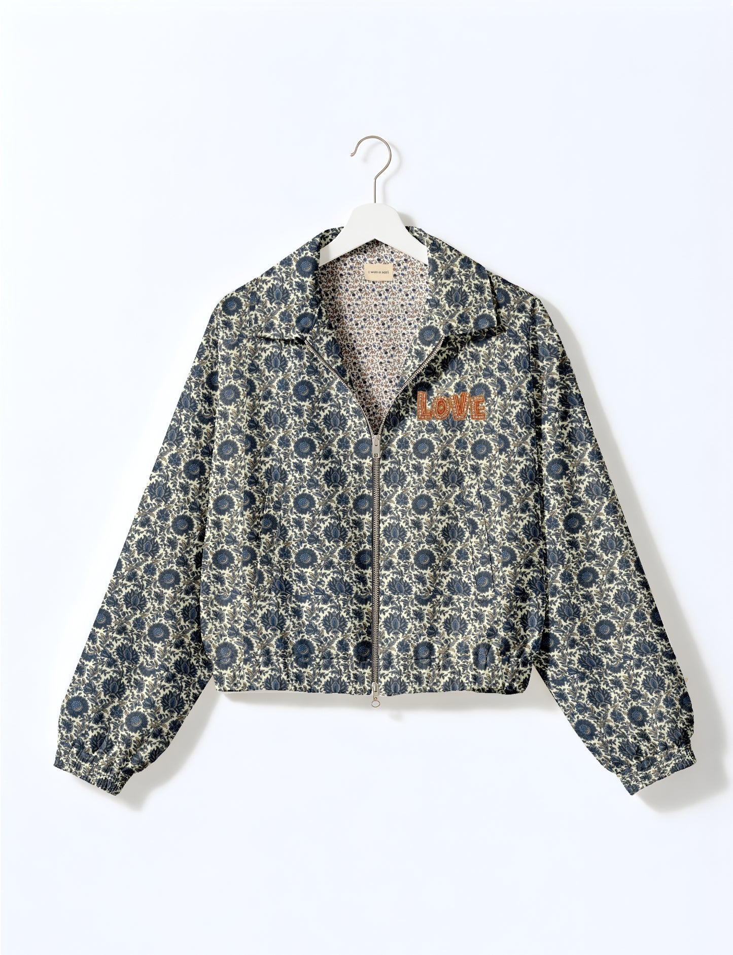 Love Bomber Jacket made from recycled fabric, featuring hand-stitched Aari embroidery. A unique piece of zero-waste clothing, part of the circular fashion movement. Designed with upcycled materials for a stylish yet environmentally friendly clothing choice.