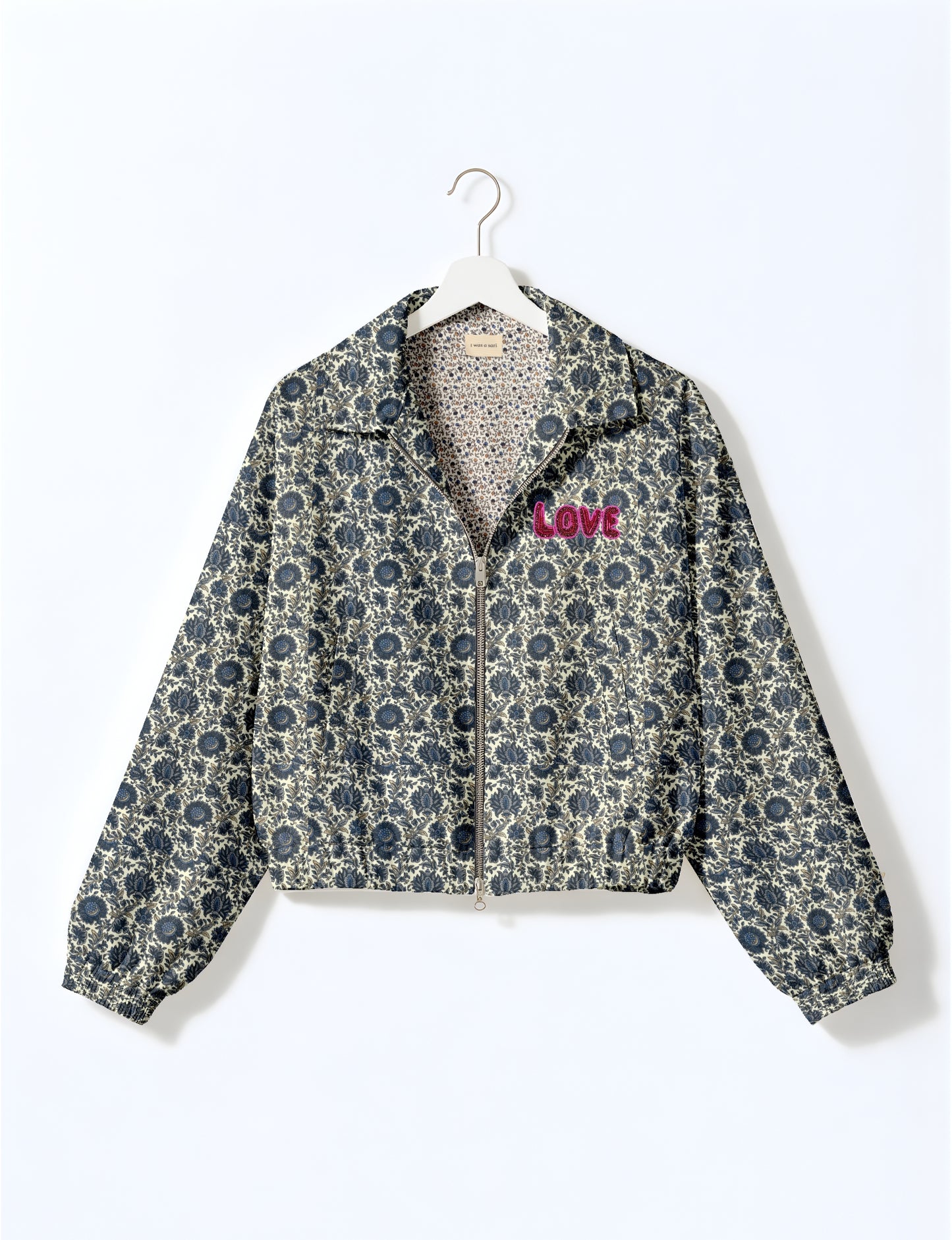 Love Bomber Jacket made from recycled fabric, featuring hand-stitched Aari embroidery. A unique piece of zero-waste clothing, part of the circular fashion movement. Designed with upcycled materials for a stylish yet environmentally friendly clothing choice.