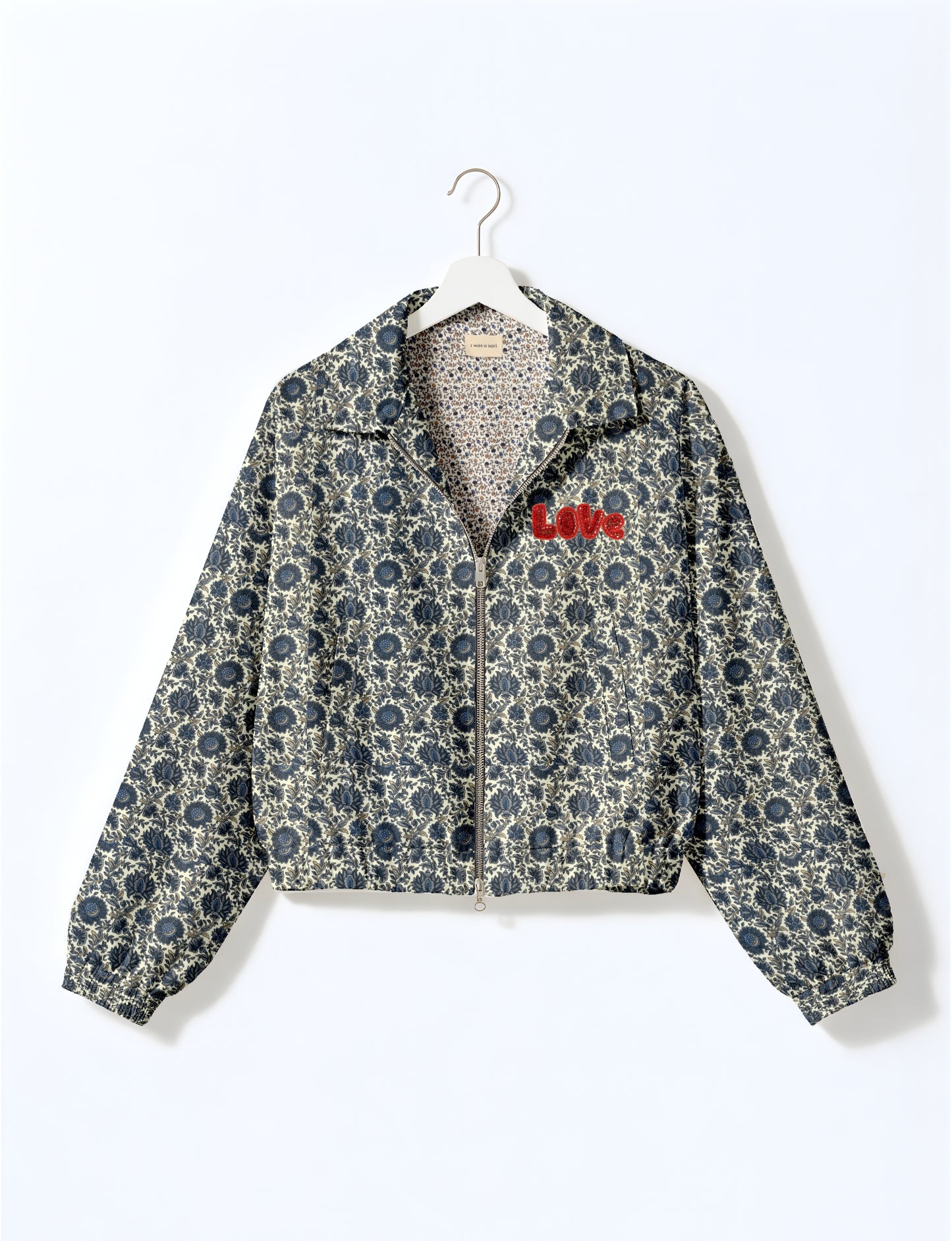 Love Bomber Jacket made from recycled fabric, featuring hand-stitched Aari embroidery. A unique piece of zero-waste clothing, part of the circular fashion movement. Designed with upcycled materials for a stylish yet environmentally friendly clothing choice.