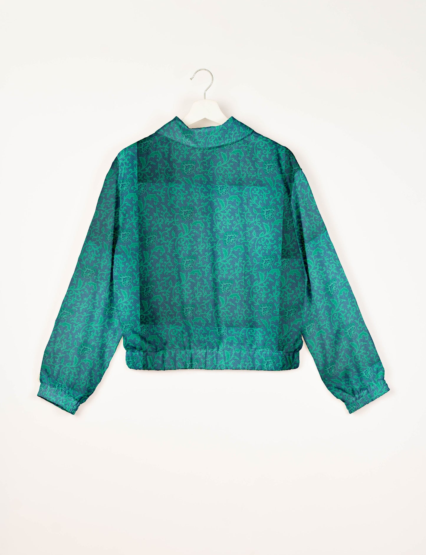 Upcycled Bomber Jacket made from recycled sari materials, featuring a cute cropped shape, elasticated hem and cuffs, and contrast sari print lining. Sustainable apparel promoting eco-friendly fashion and ethical clothing.