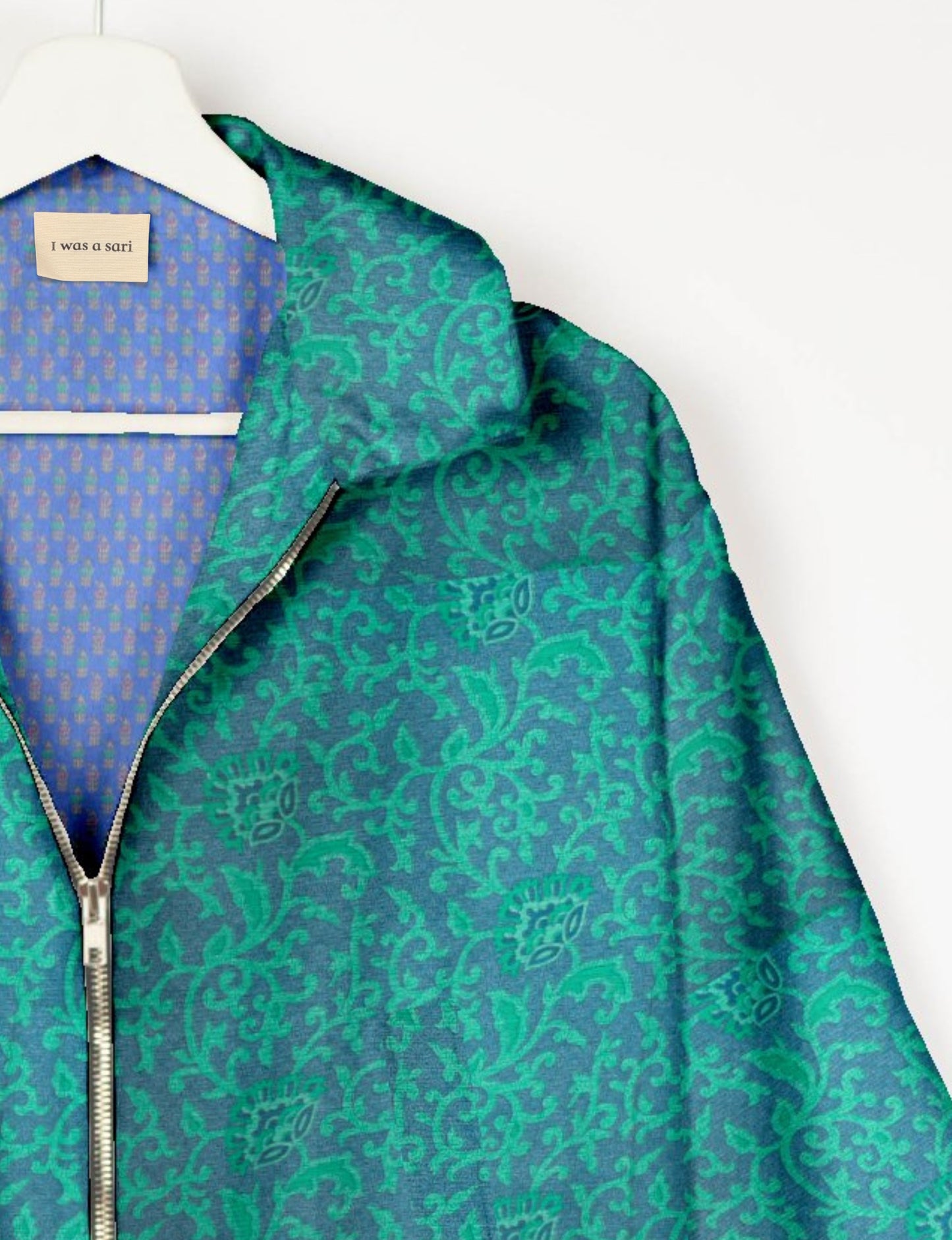 Upcycled Bomber Jacket made from recycled sari materials, featuring a cute cropped shape, elasticated hem and cuffs, and contrast sari print lining. Sustainable apparel promoting eco-friendly fashion and ethical clothing.