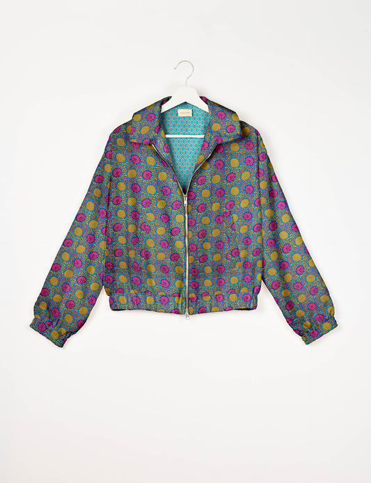 Upcycled Bomber Jacket made from recycled sari materials, featuring a cute cropped shape, elasticated hem and cuffs, and contrast sari print lining. Sustainable apparel promoting eco-friendly fashion and ethical clothing.