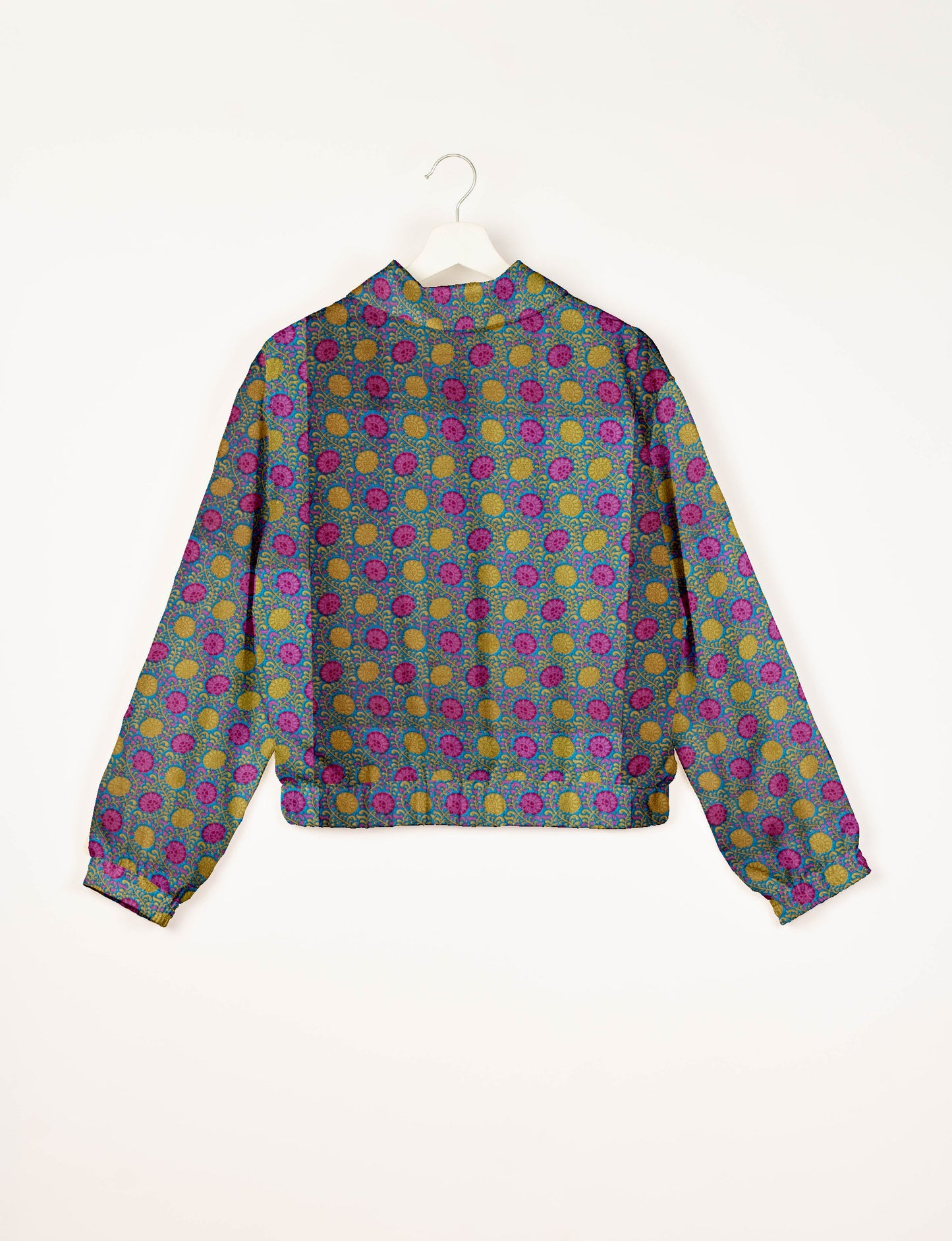 Upcycled Bomber Jacket made from recycled sari materials, featuring a cute cropped shape, elasticated hem and cuffs, and contrast sari print lining. Sustainable apparel promoting eco-friendly fashion and ethical clothing.