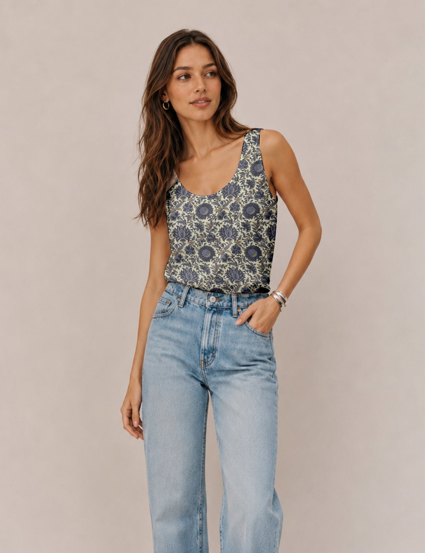 Women's sleeveless blouse with a relaxed straight fit, wide scoop neckline, deep scoop back, and hip-length silhouette.