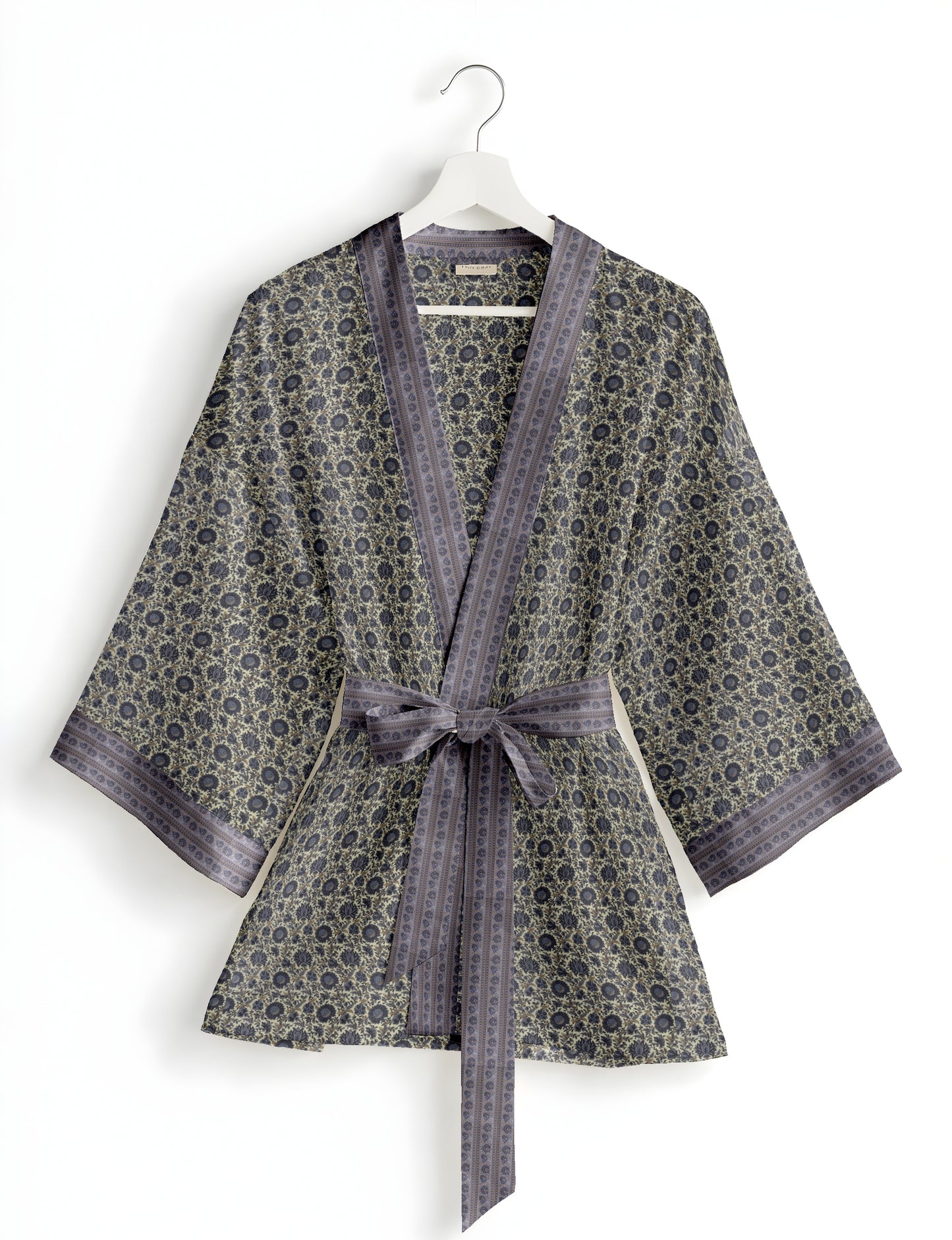 Short kimono robe with wrap front, V-neckline, wide sleeves, waist tie, and concealed skort detail.