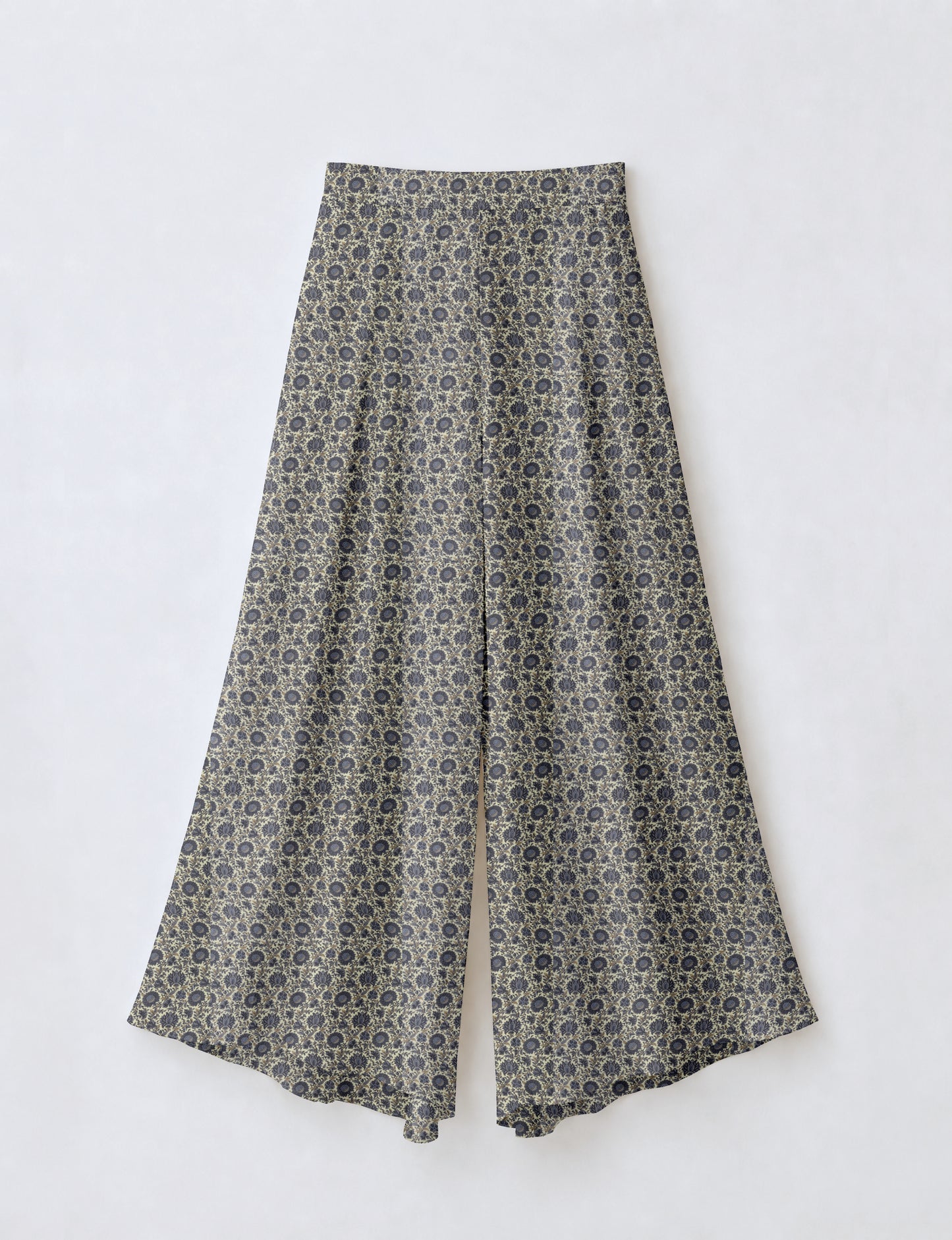 Blue wide leg palazzo trousers with a small tropical floral pattern, flat lay front view