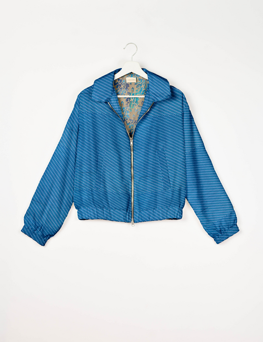 Upcycled Bomber Jacket made from recycled sari materials, featuring a cute cropped shape, elasticated hem and cuffs, and contrast sari print lining. Sustainable apparel promoting eco-friendly fashion and ethical clothing.
