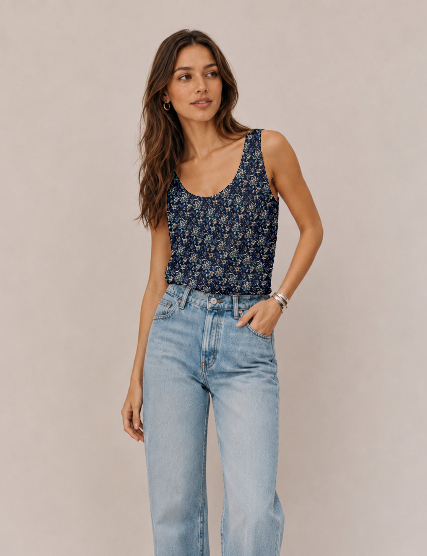 Women's sleeveless blouse with a relaxed straight fit, wide scoop neckline, deep scoop back, and hip-length silhouette.