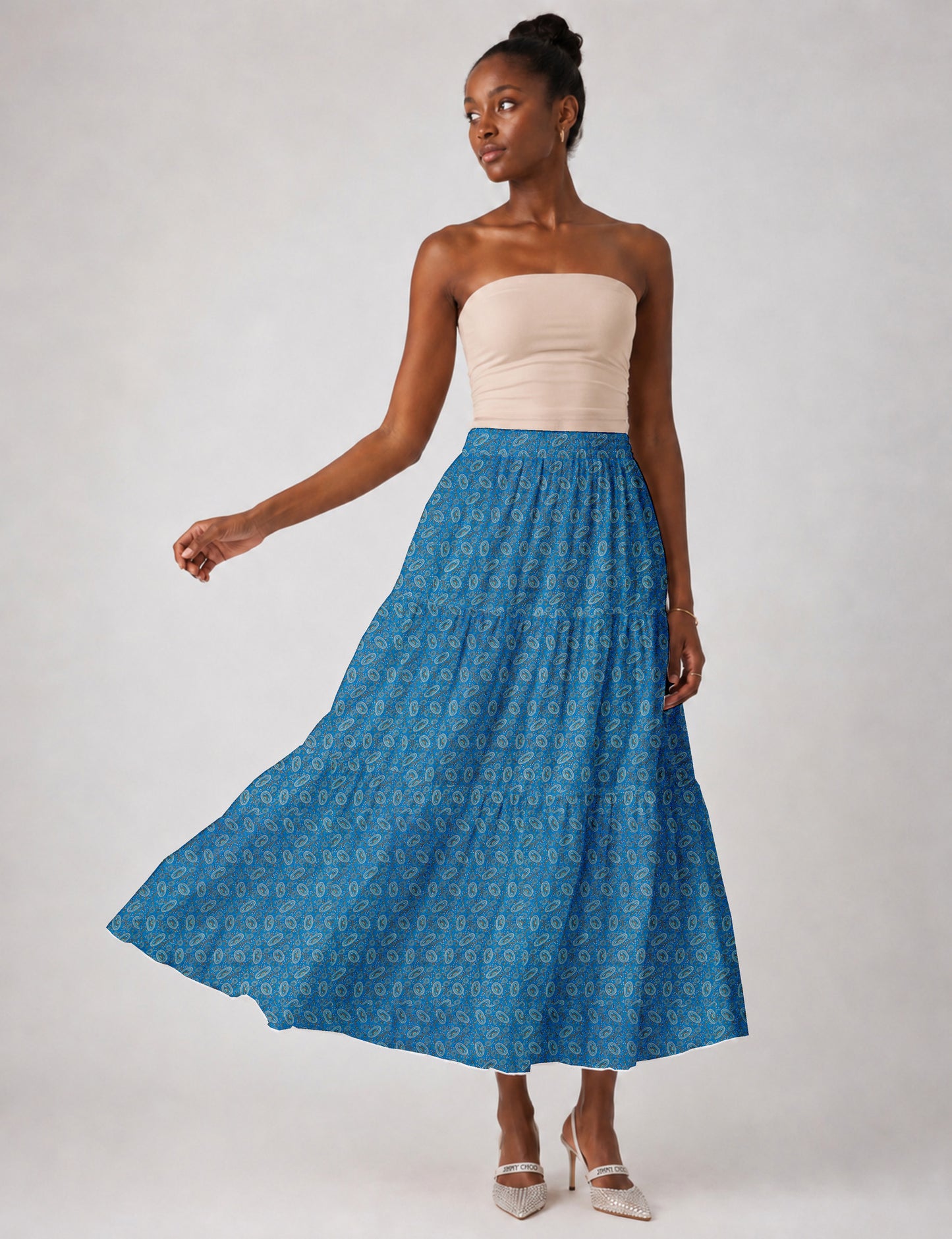 Yellow midi tiered skirt with small dark geometric micro pattern, flat lay front view