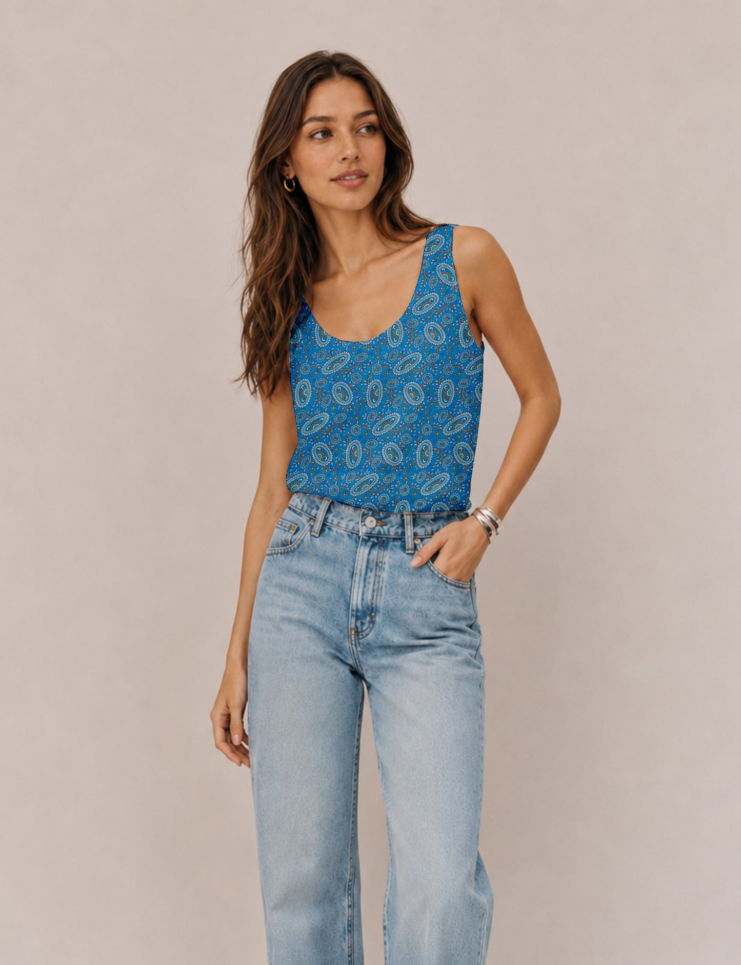 Women's sleeveless blouse with a relaxed straight fit, wide scoop neckline, deep scoop back, and hip-length silhouette.