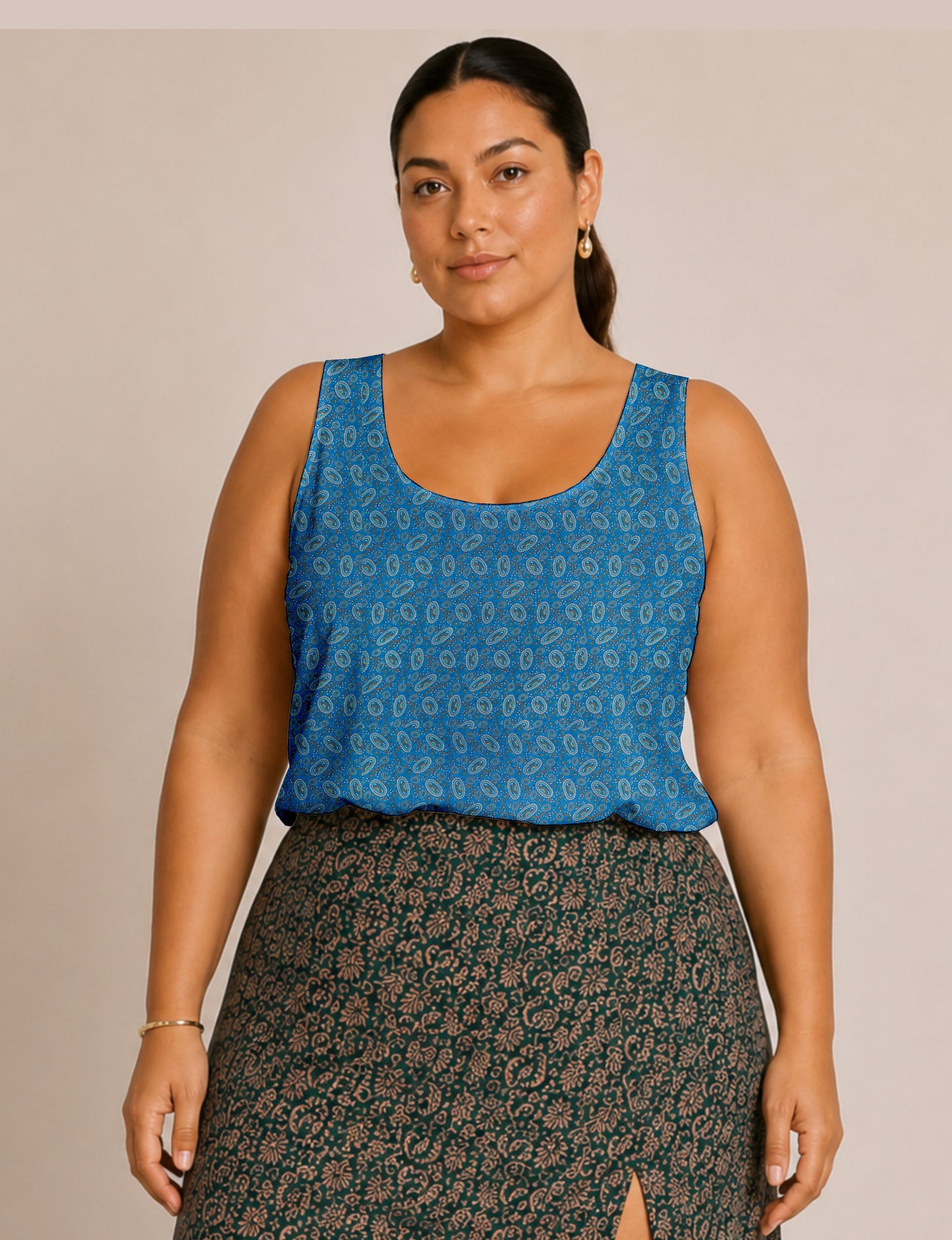 Women's sleeveless blouse with a relaxed straight fit, wide scoop neckline, deep scoop back, and hip-length silhouette.