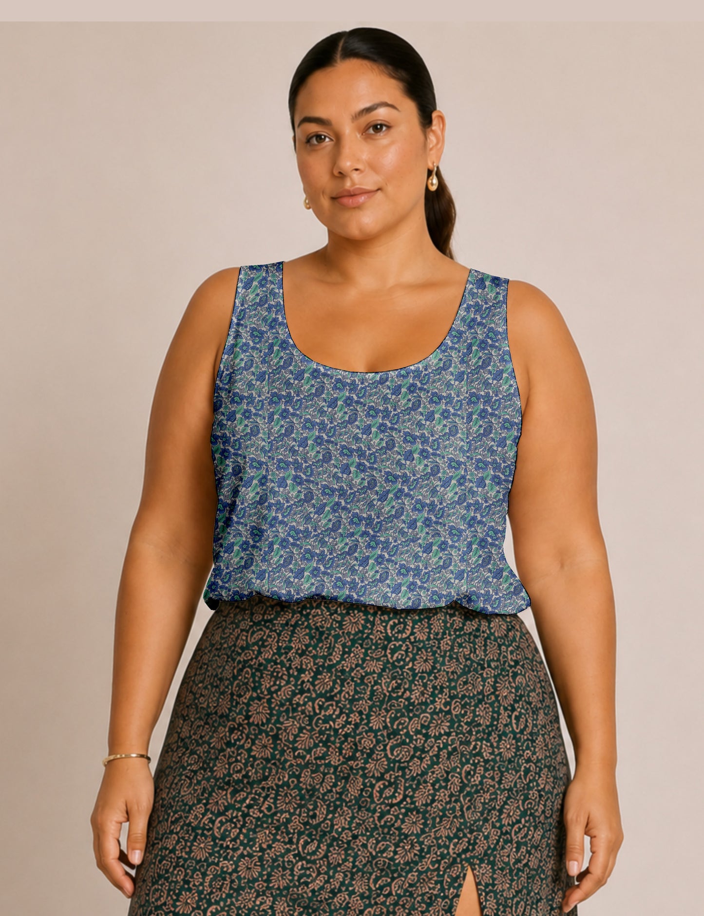 Women's sleeveless blouse with a relaxed straight fit, wide scoop neckline, deep scoop back, and hip-length silhouette.