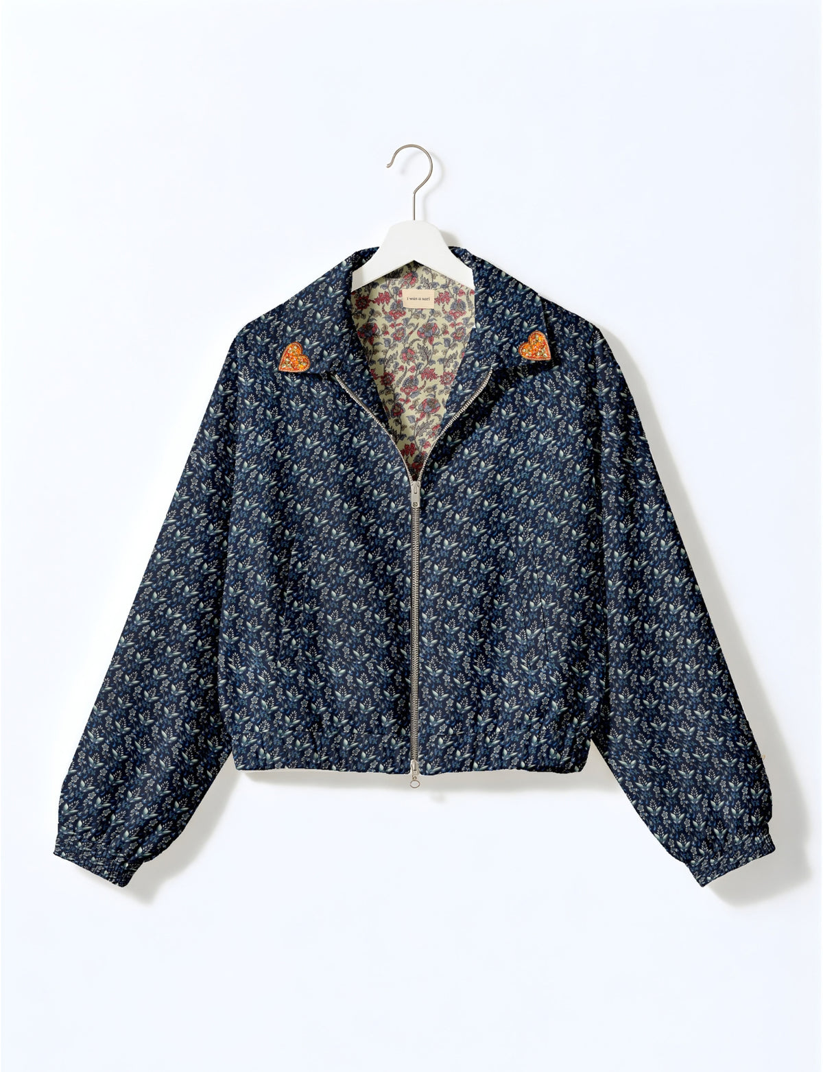 Love Bomber Jacket made from recycled fabric, featuring hand-stitched Aari embroidery. A unique piece of zero-waste clothing, part of the circular fashion movement. Designed with upcycled materials for a stylish yet environmentally friendly clothing choice.